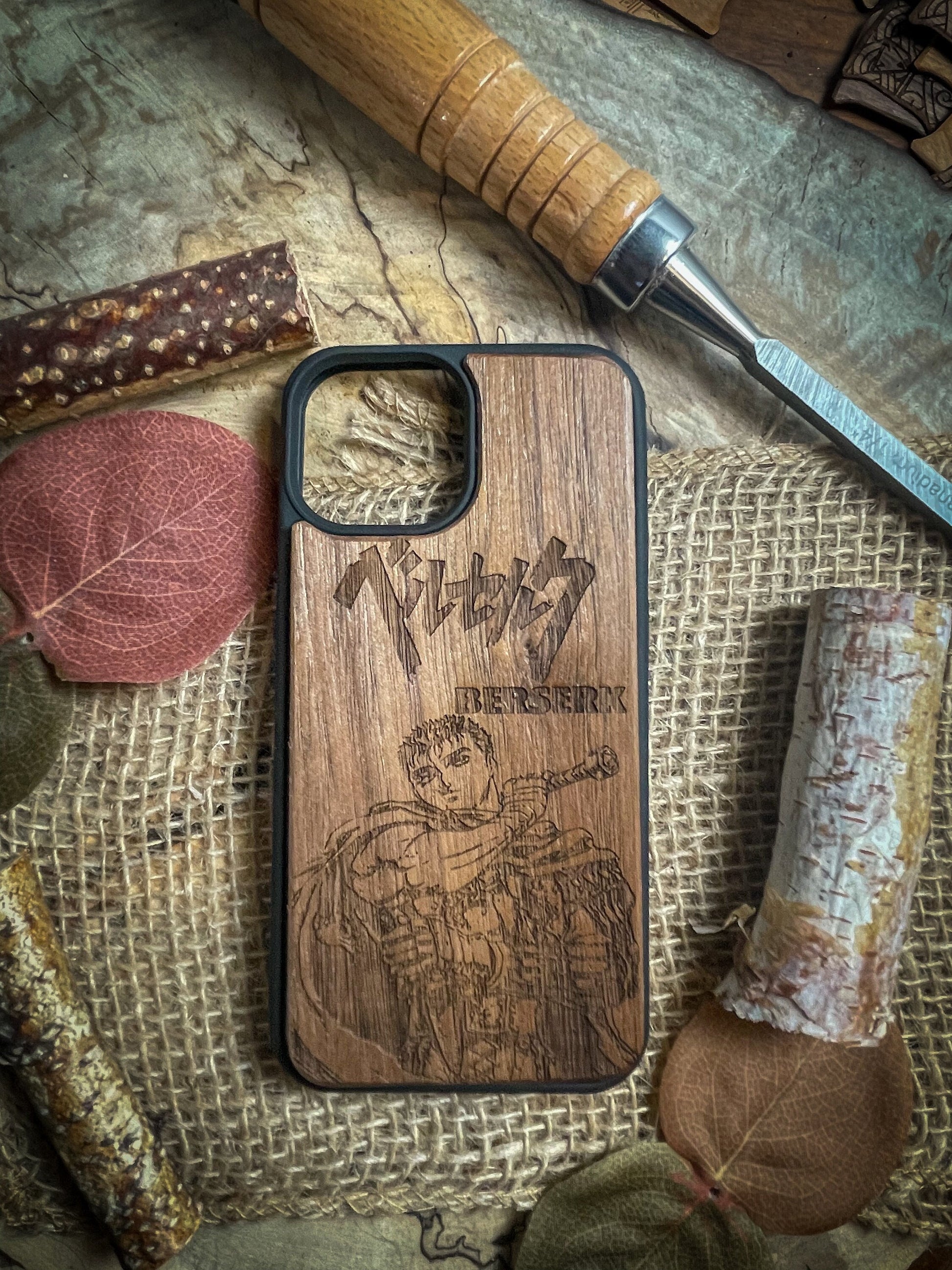 a wooden phone case sitting on top of a table