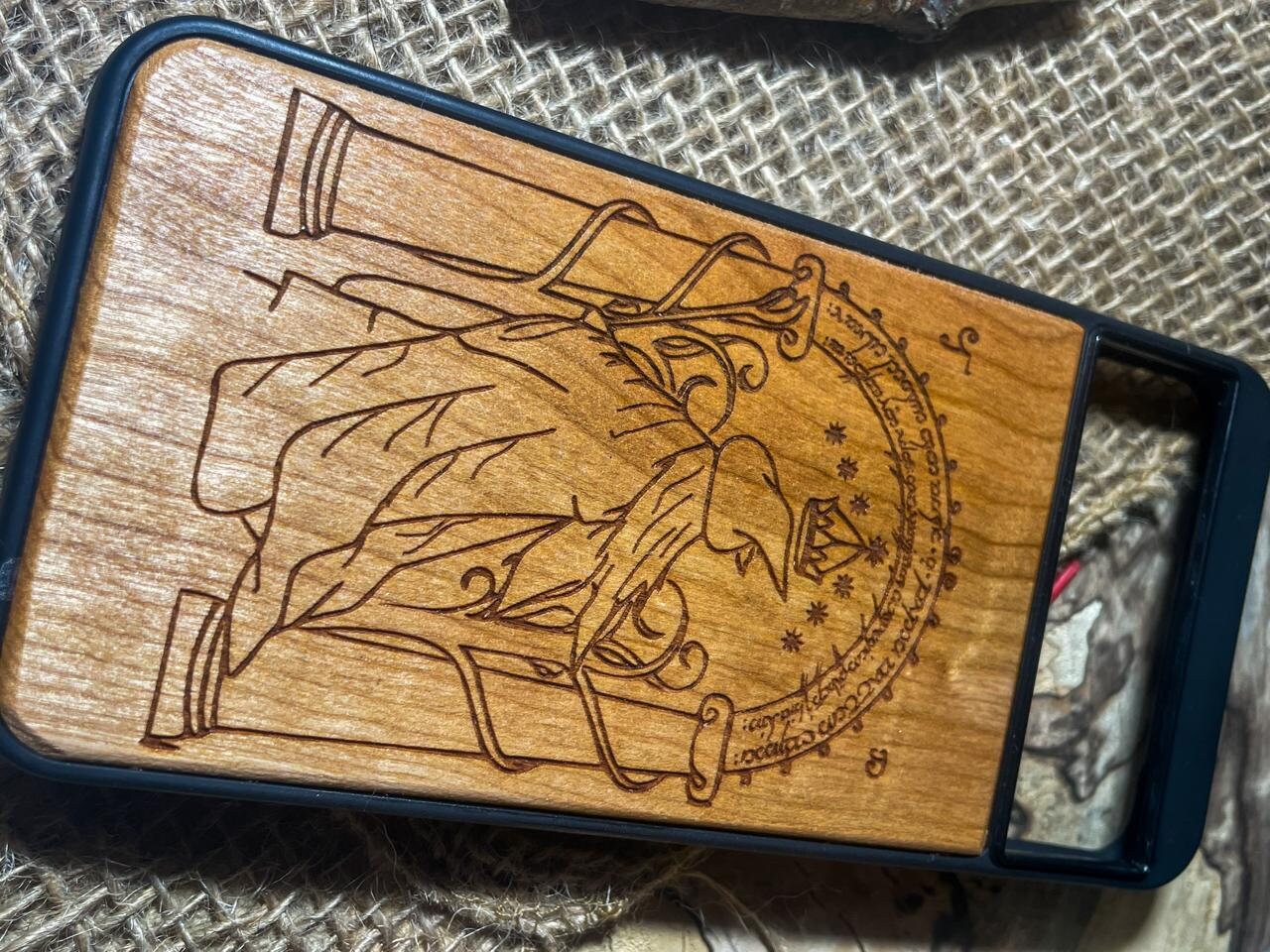 a wooden phone case with a picture of a knight on it