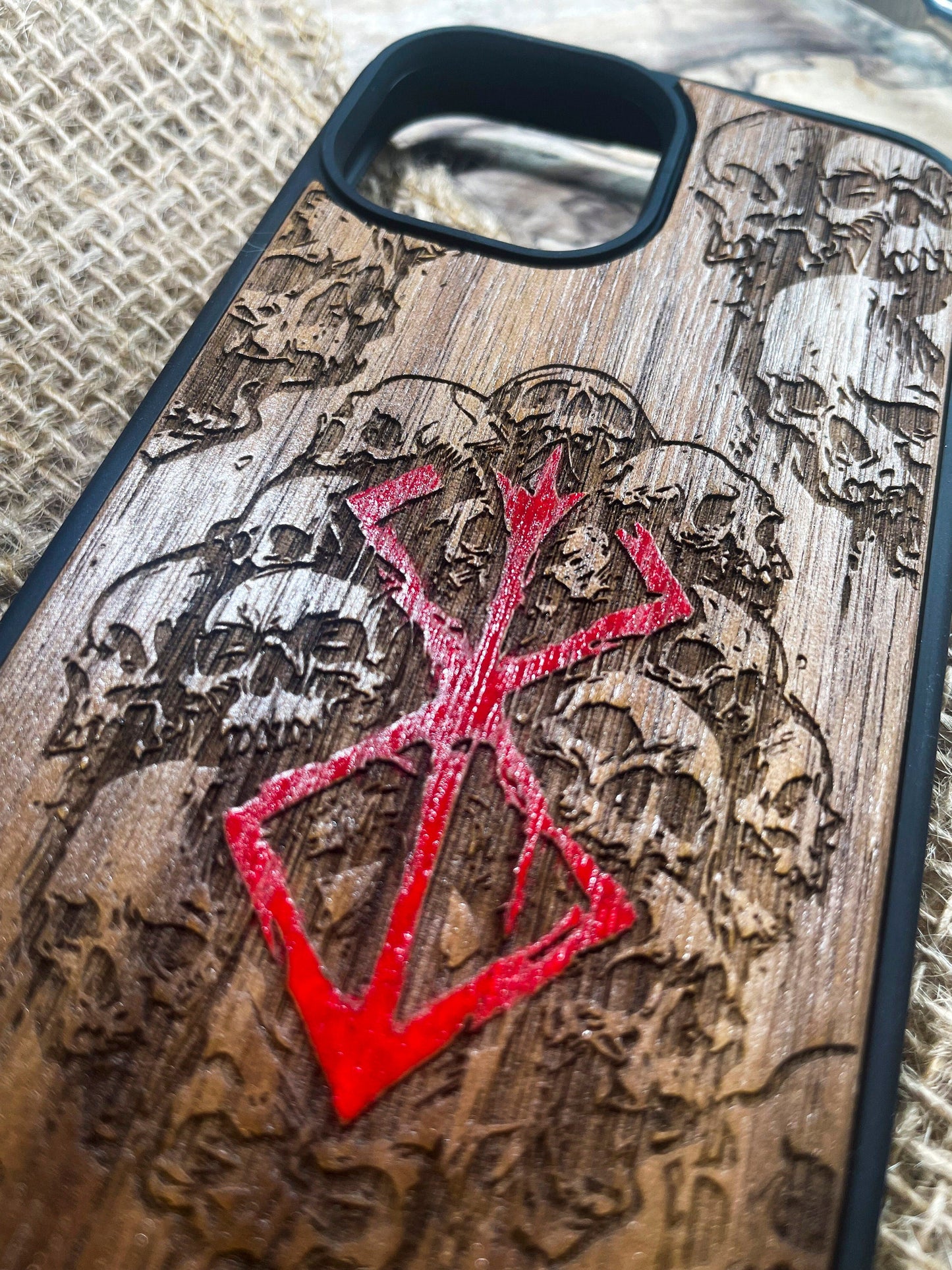 a wooden phone case with a design on it