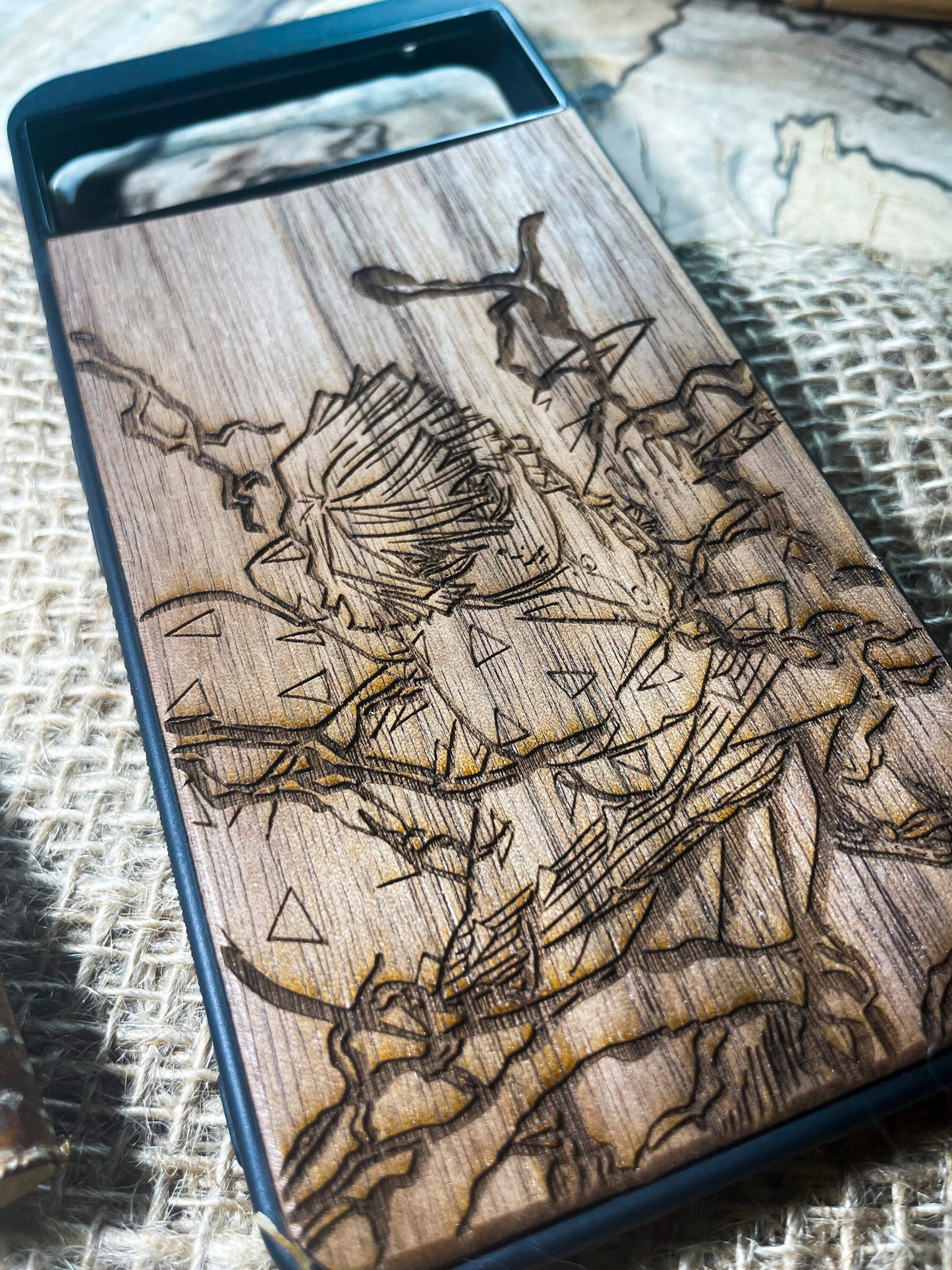 a wooden phone case with a picture of a skeleton on it