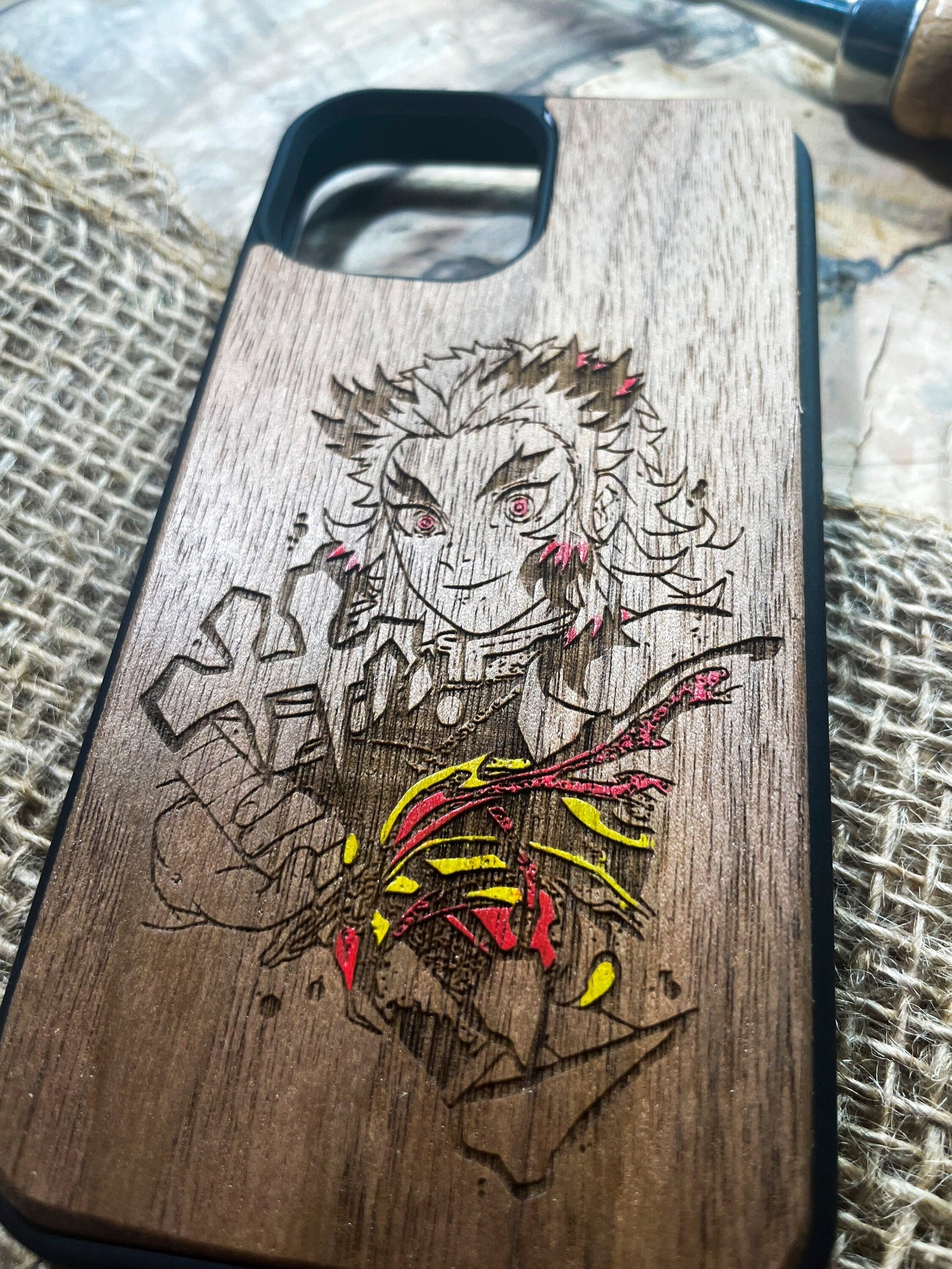 a wooden phone case with a drawing of a man on it