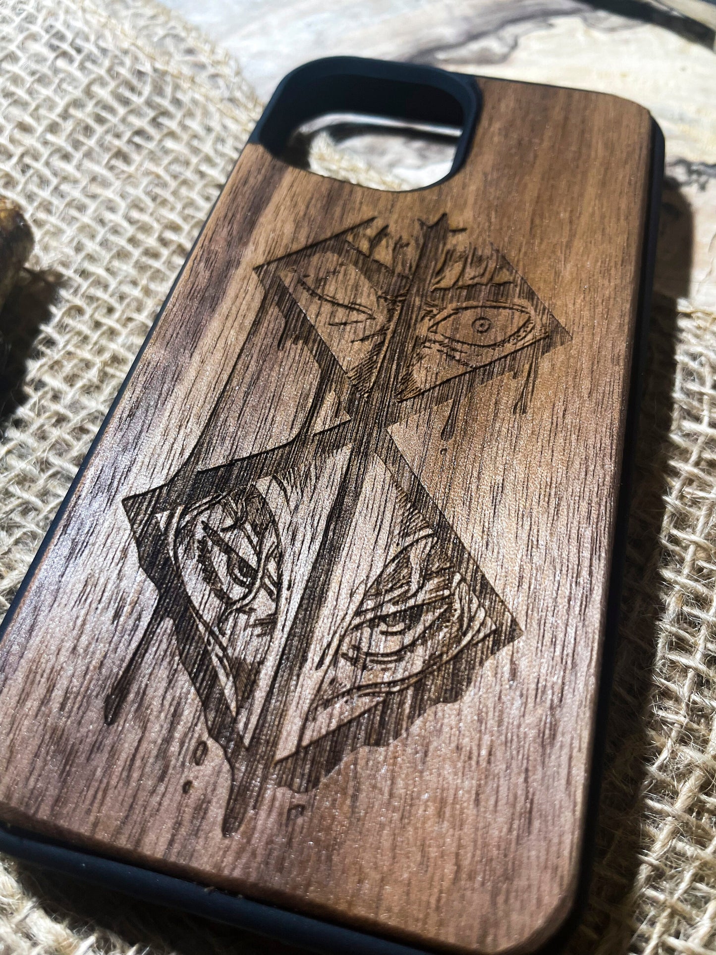 a wooden case with a picture of a cross on it