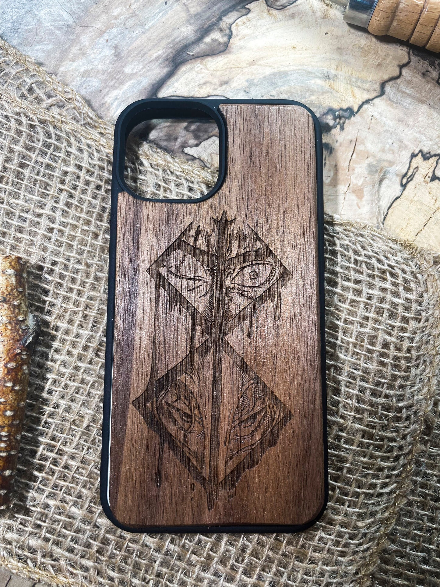 a wooden phone case with a design on it