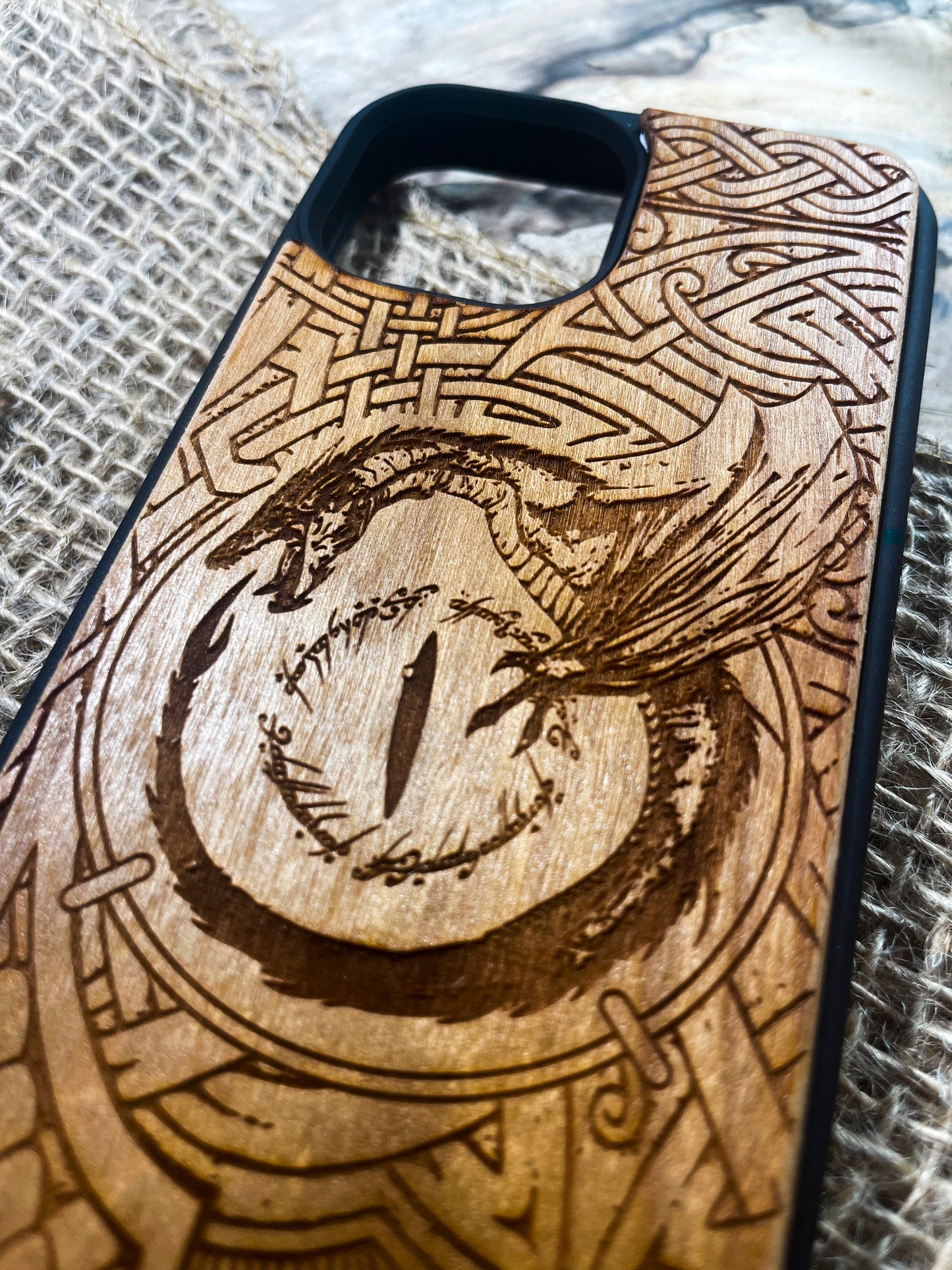 a wooden phone case with a picture of a bird on it