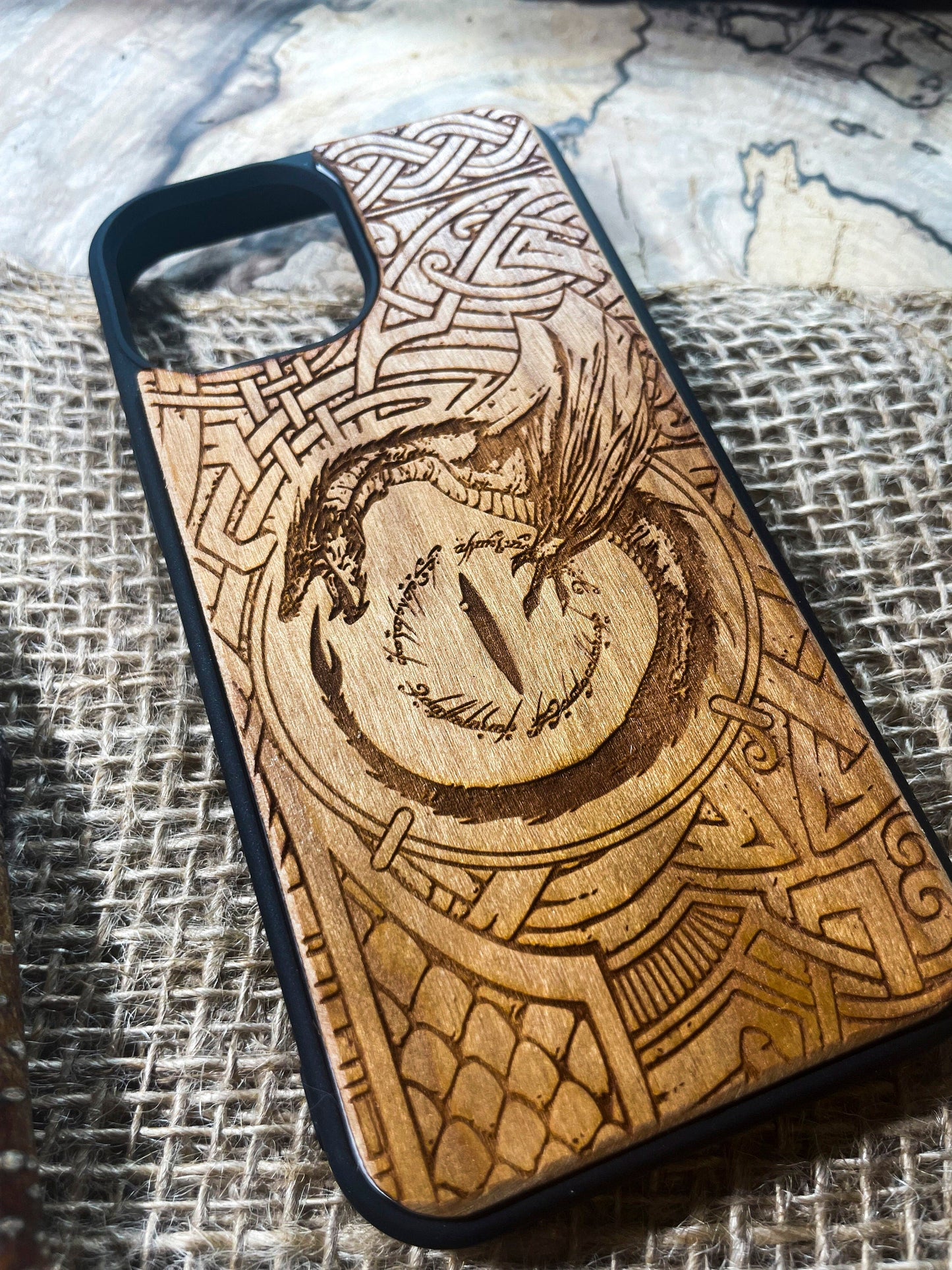 a wooden phone case with a picture of a bird on it