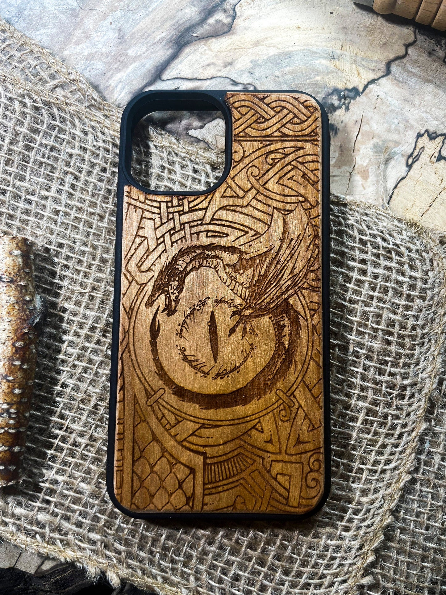 a wooden phone case with a picture of a bird on it