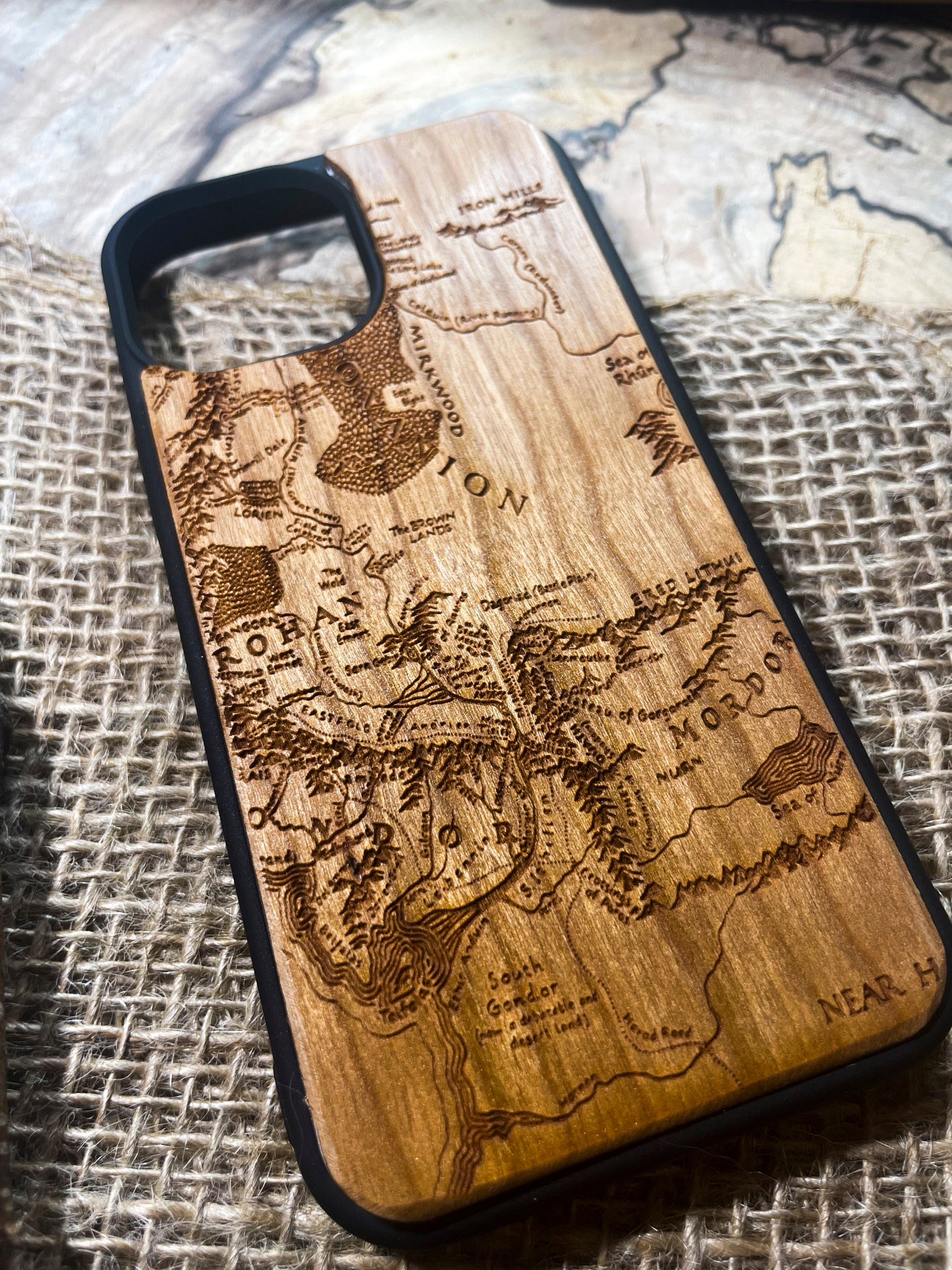 a wooden phone case with a map on it