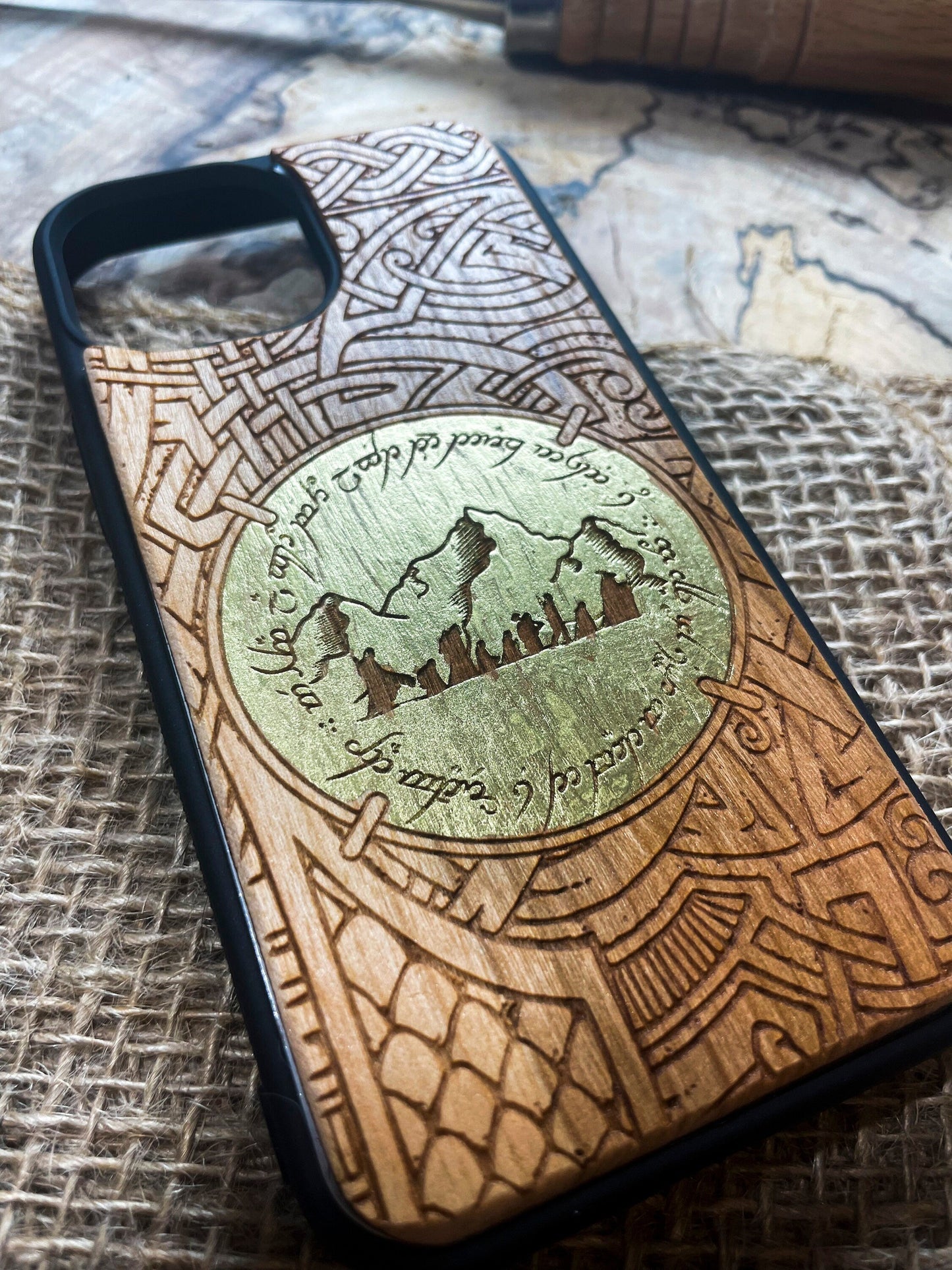 a wooden phone case with a map on it