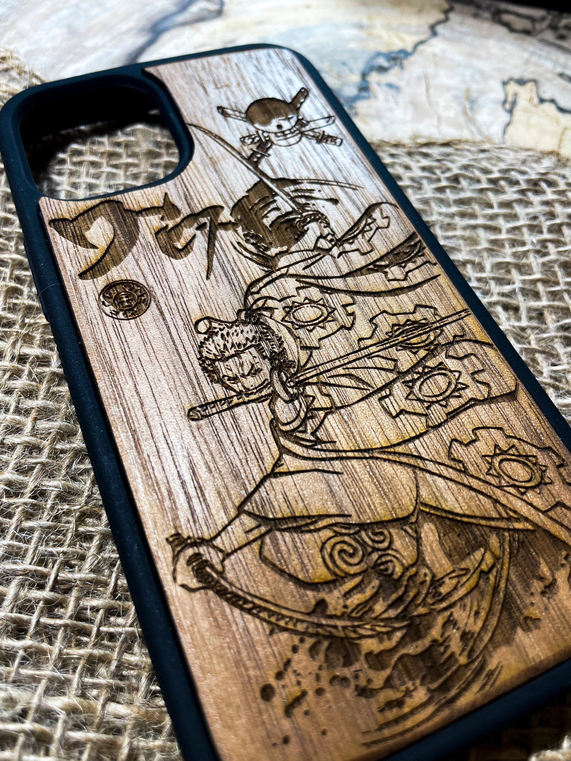 a wooden phone case with a picture of a pirate on it