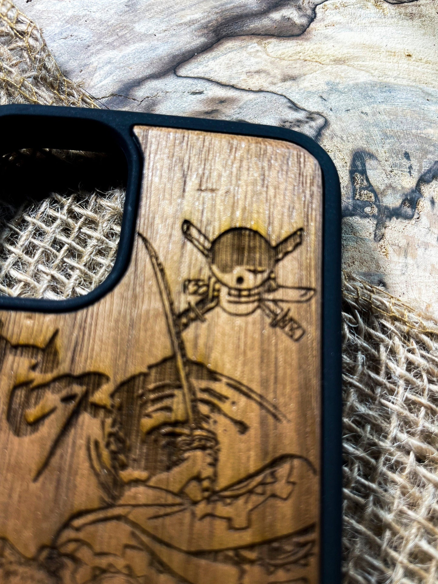 a wooden phone case with a picture of a pirate on it