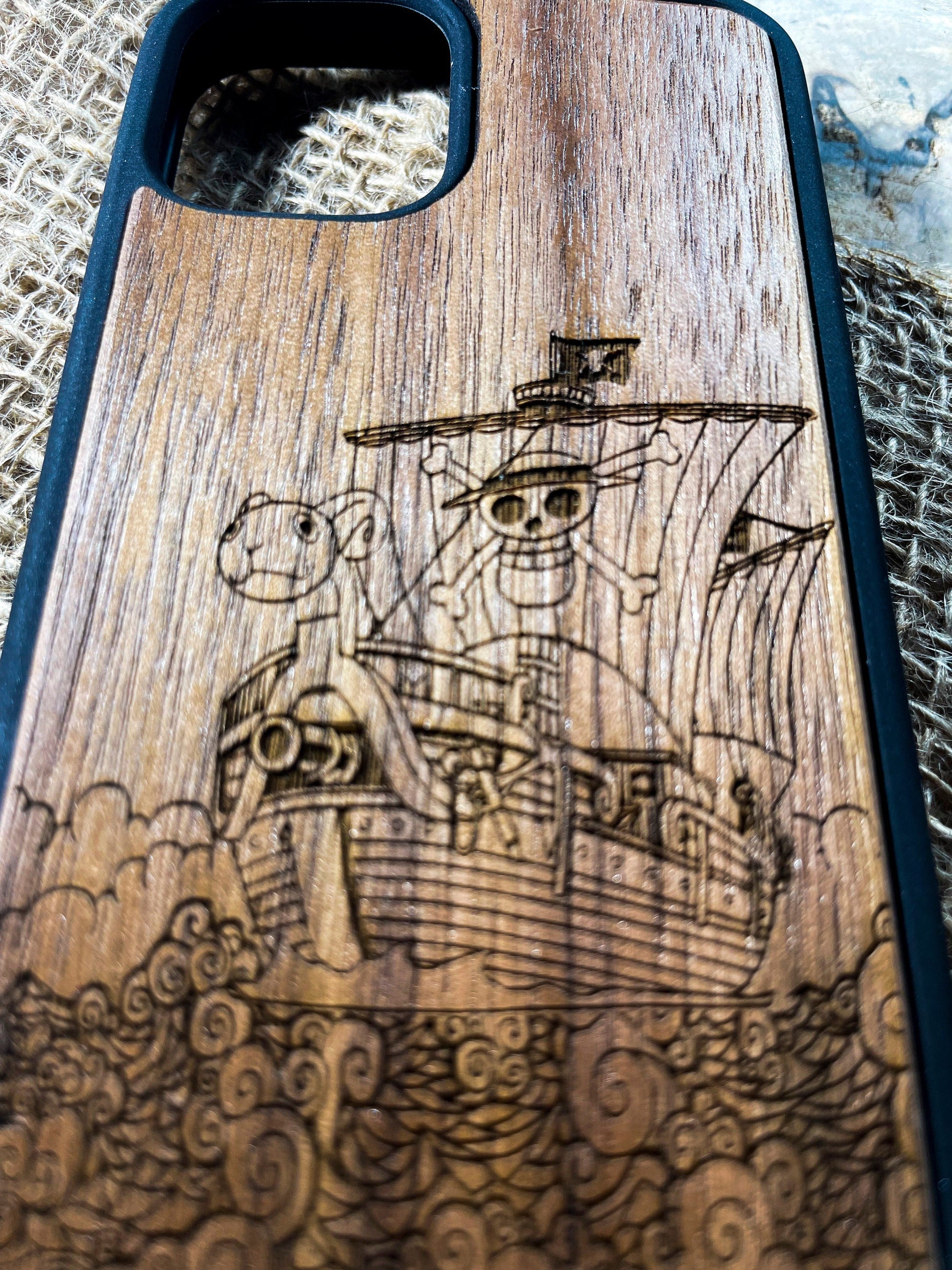 a wooden case with a picture of a ship on it