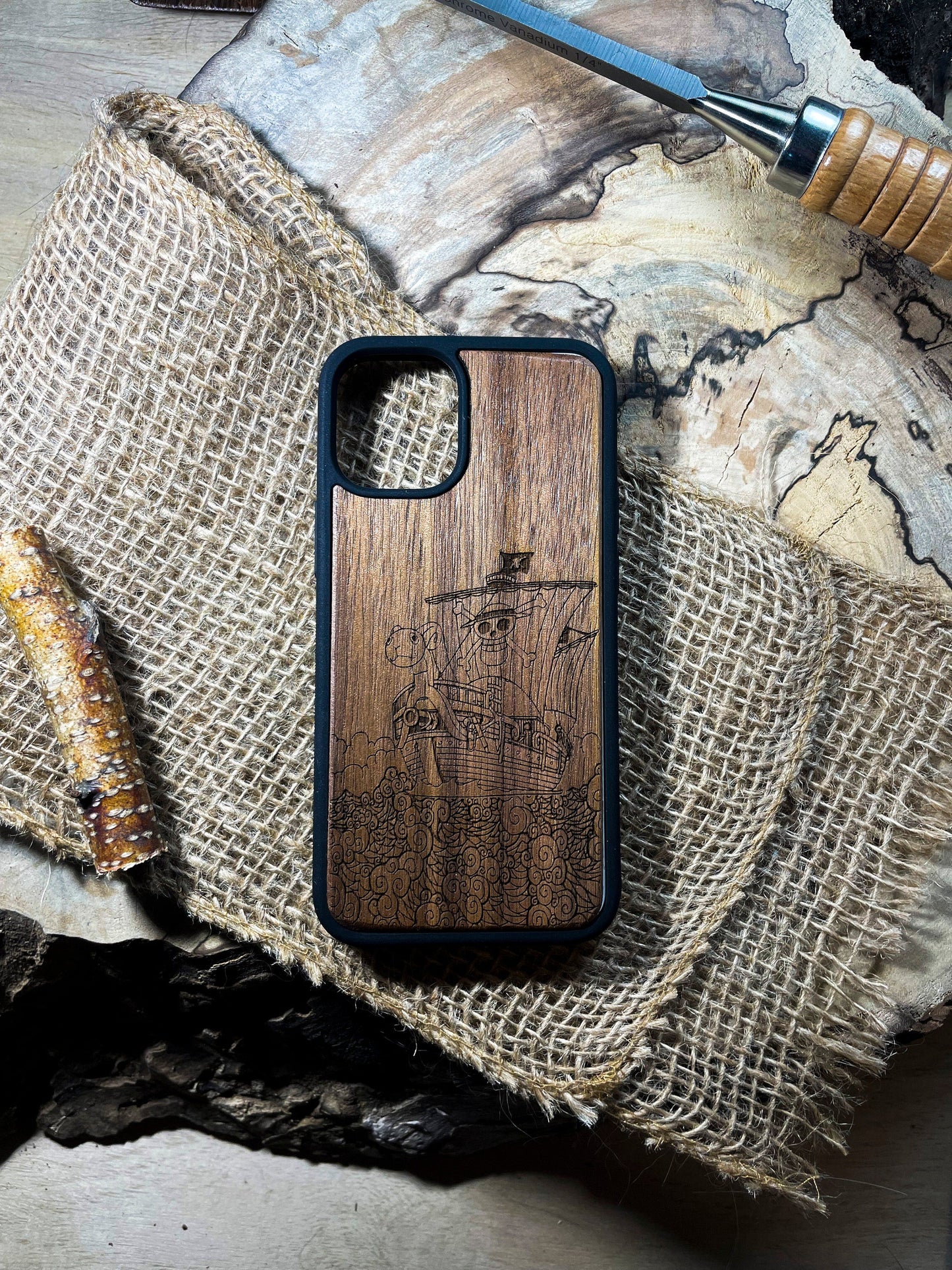 a wooden case sitting on top of a piece of wood