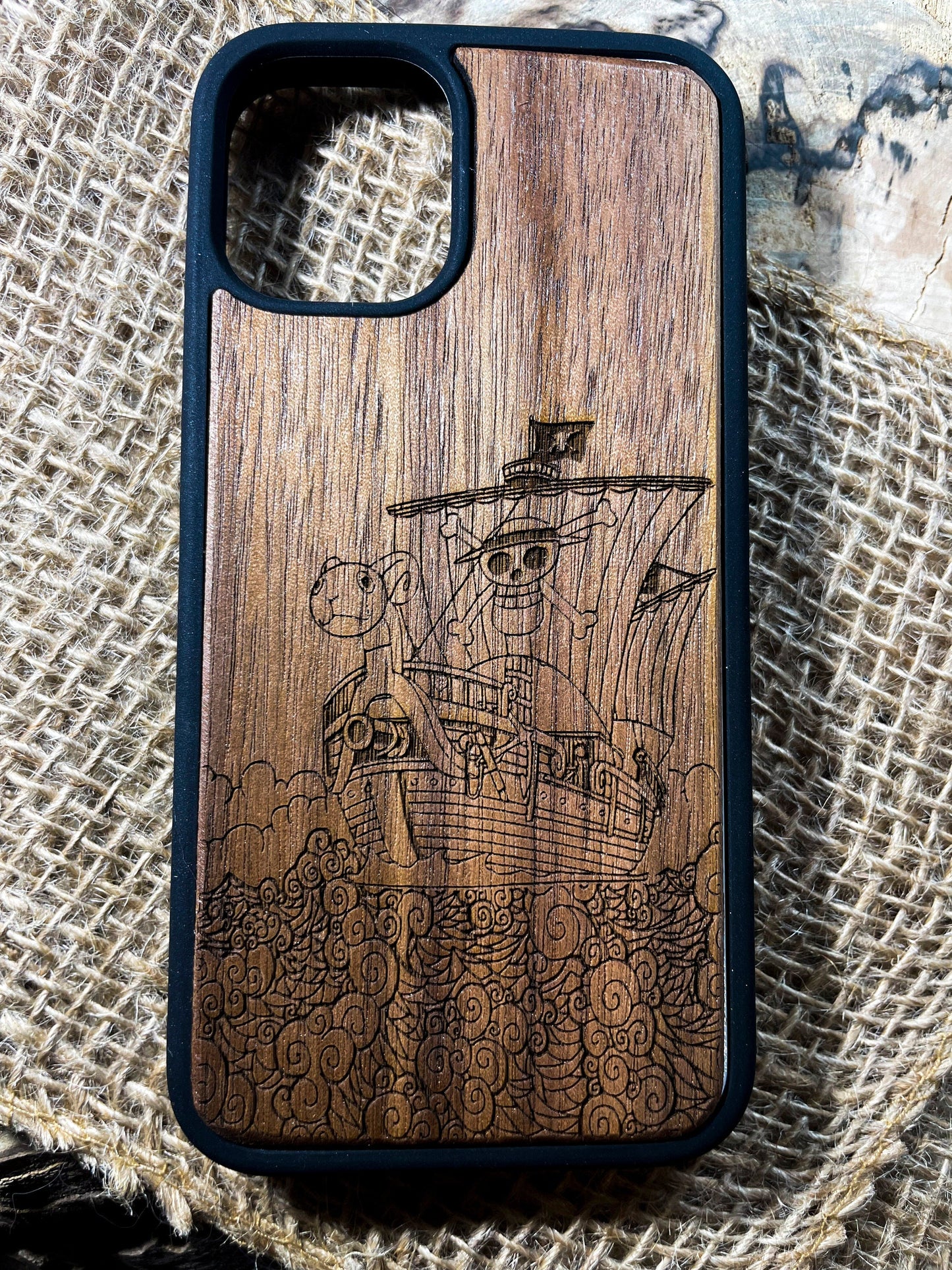 a wooden case with a picture of a pirate ship on it