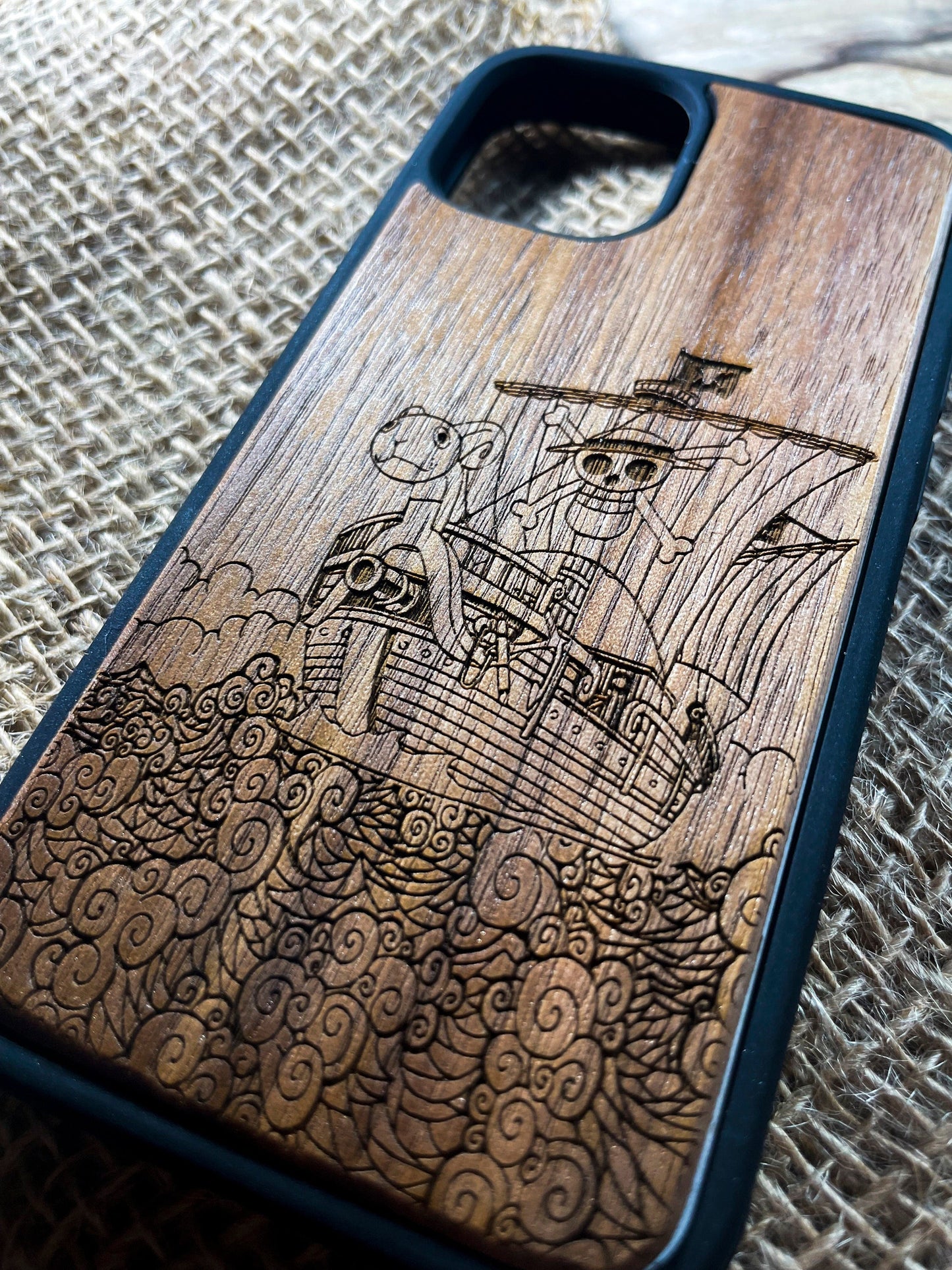 a wooden phone case with a picture of a ship