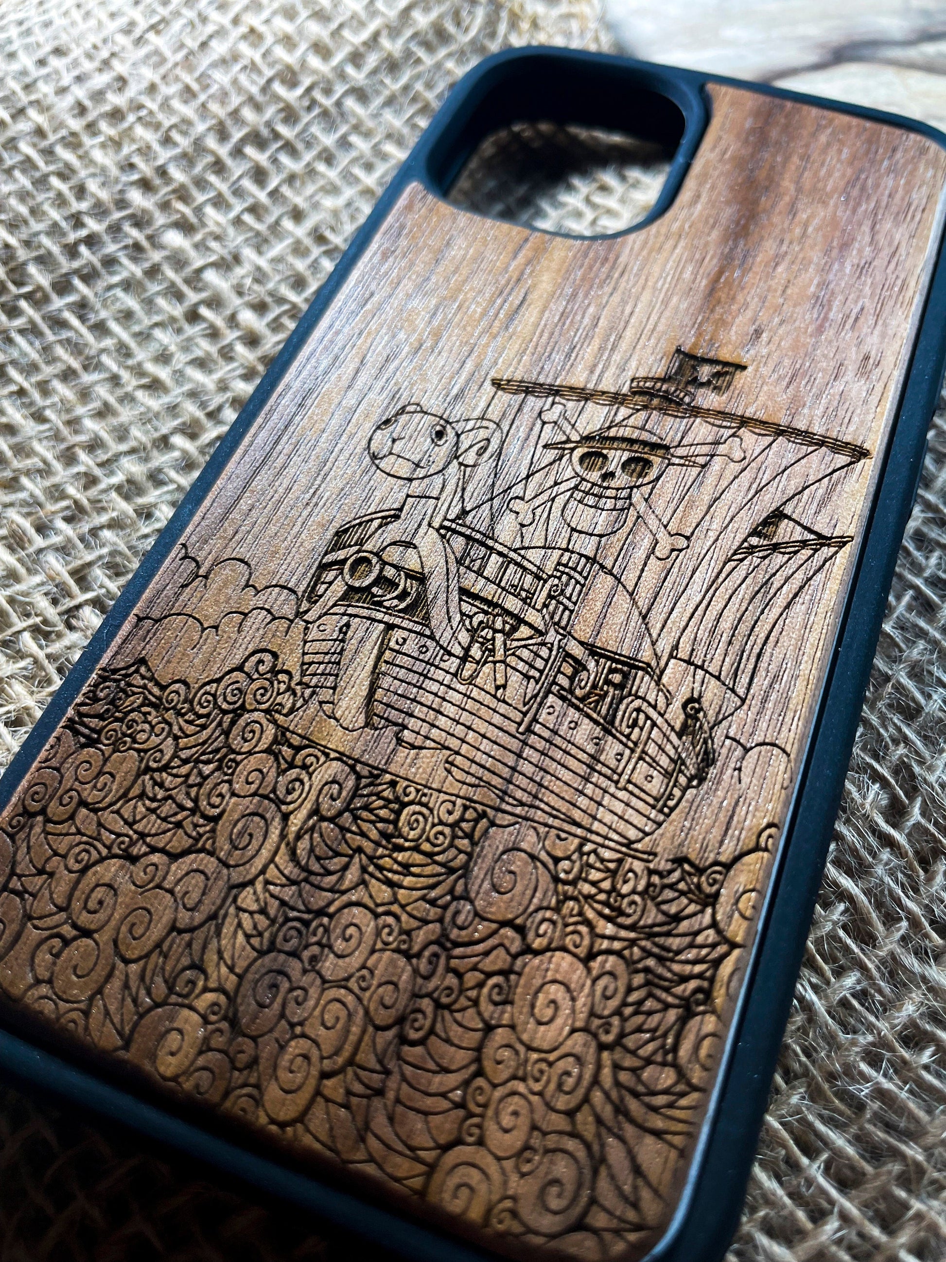 a wooden phone case with a picture of a ship