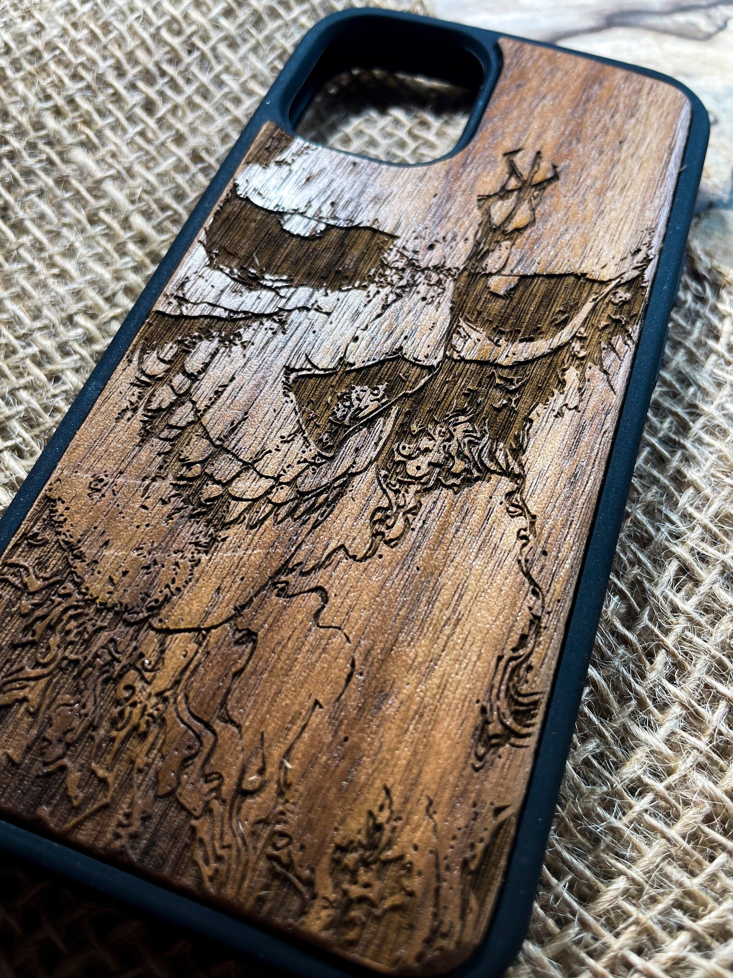 a wooden phone case with a picture of a deer