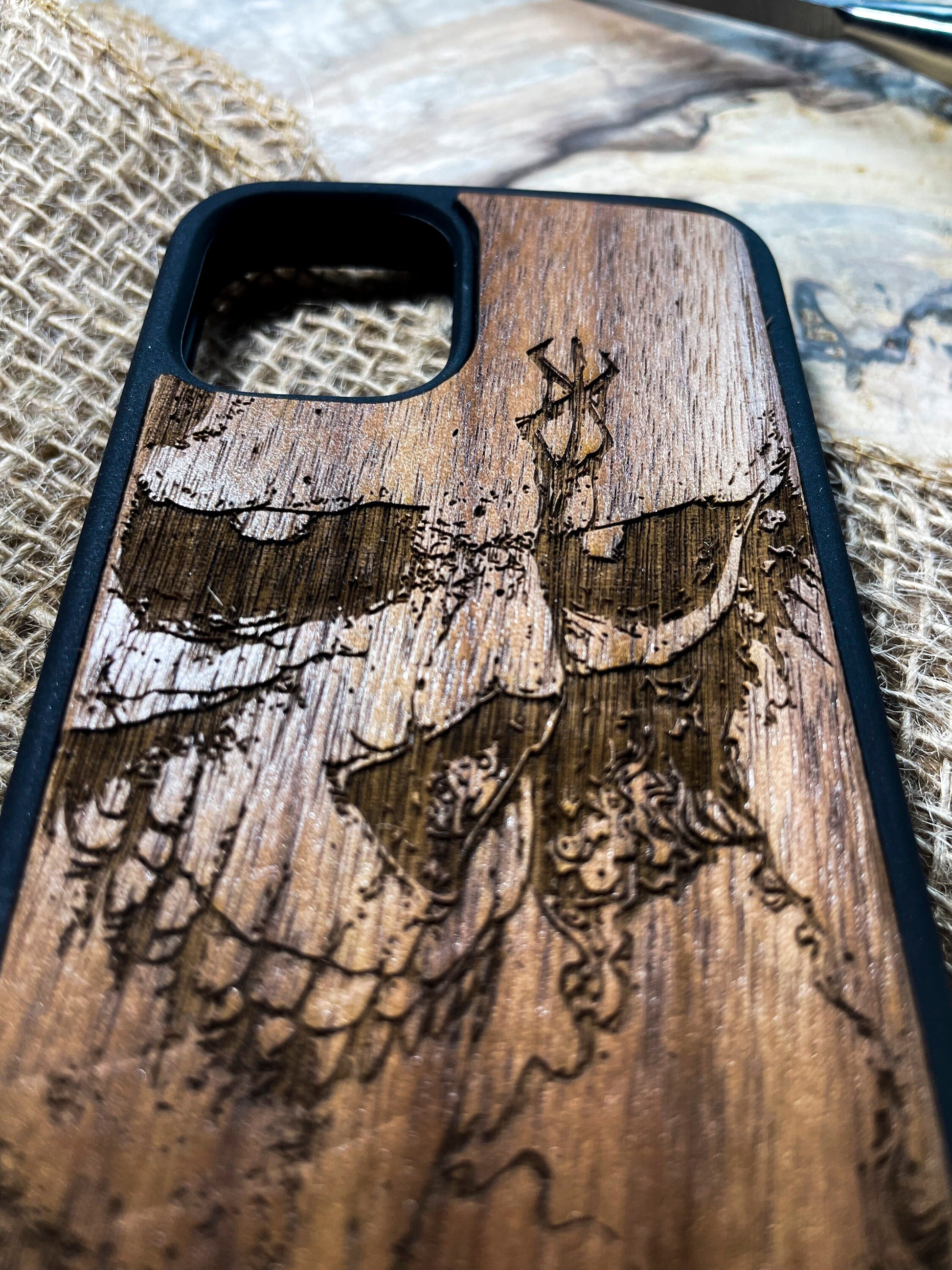 a wooden phone case with a picture of a woman on it