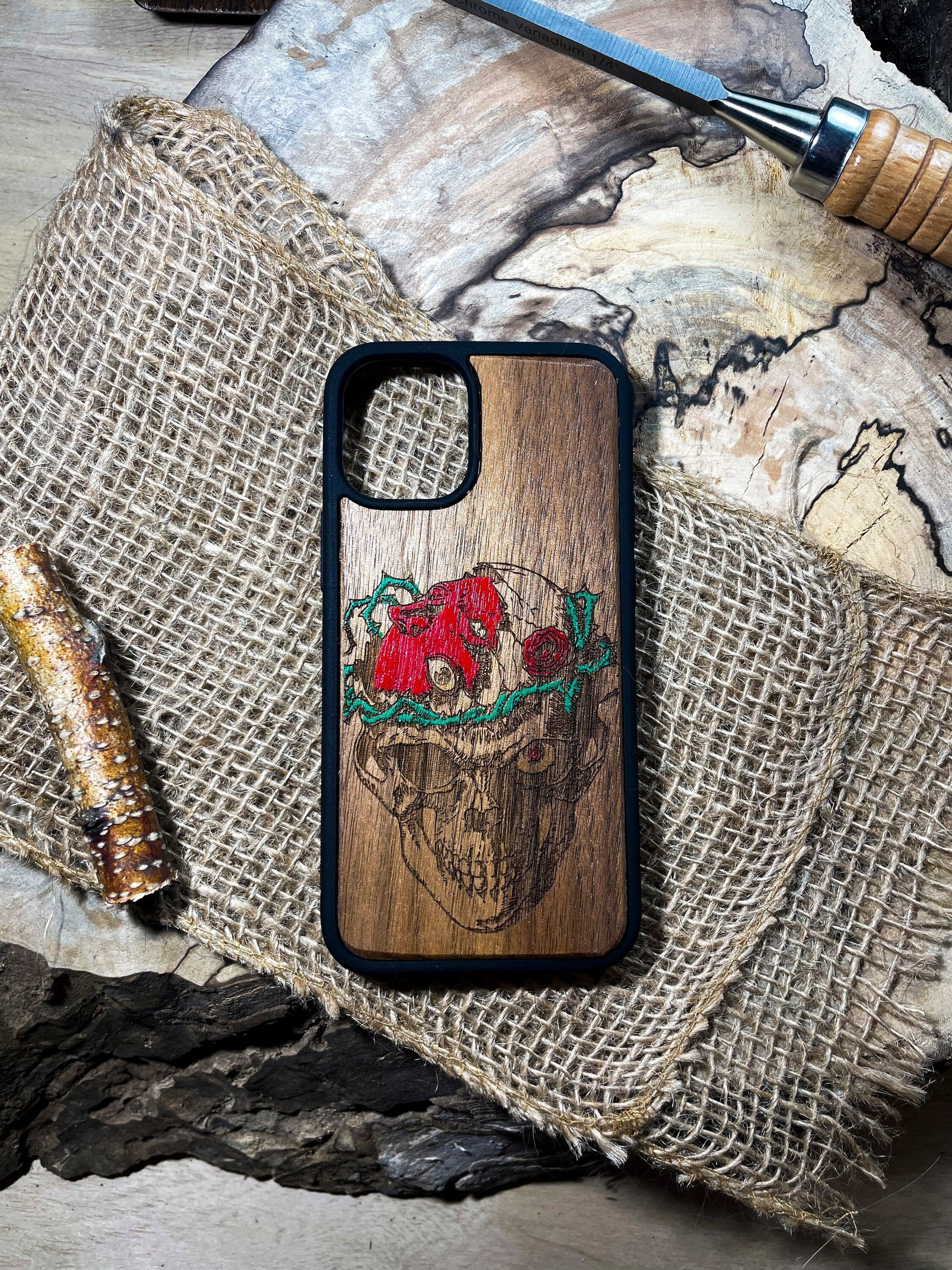 a wooden phone case with a picture of a bull on it