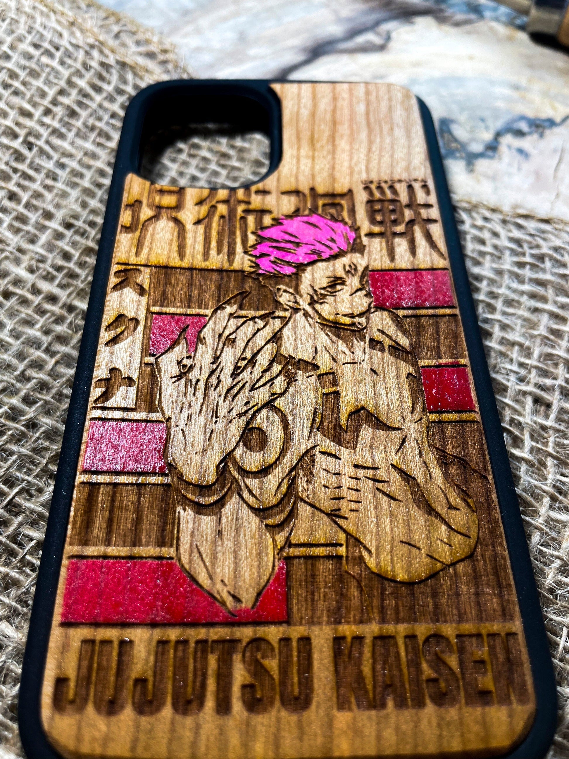 a wooden phone case with a picture of a person on it