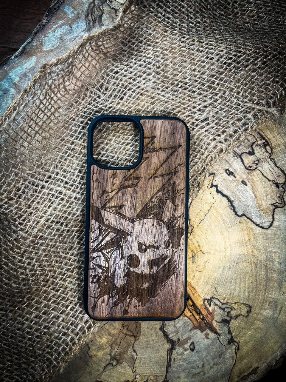 a wooden phone case with a pirate skull on it