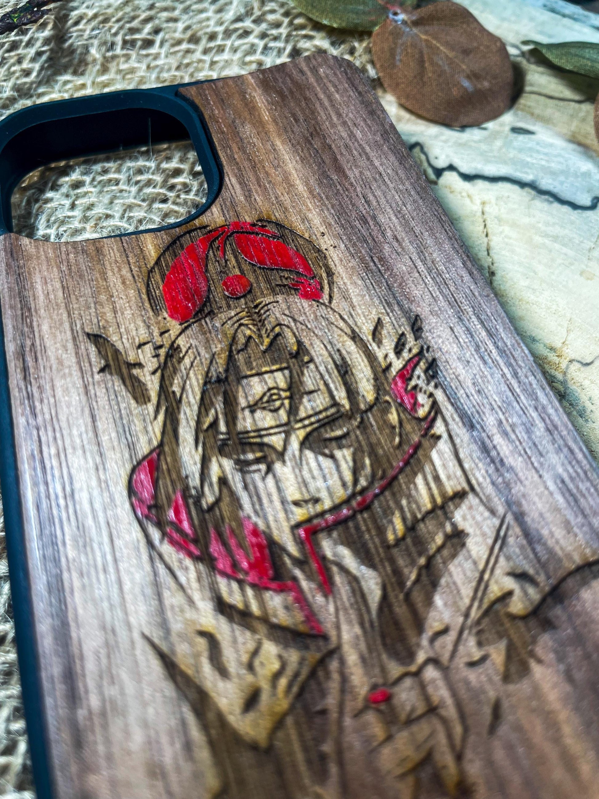 a wooden phone case with a picture of a woman on it