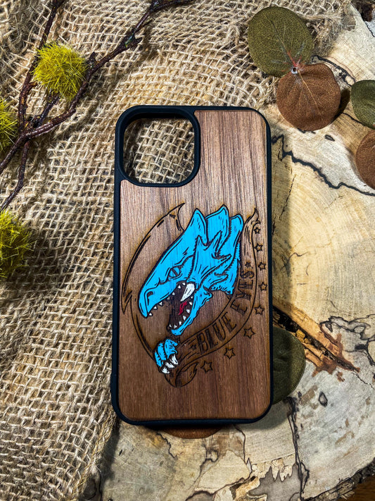 a wooden phone case with a picture of a shark on it