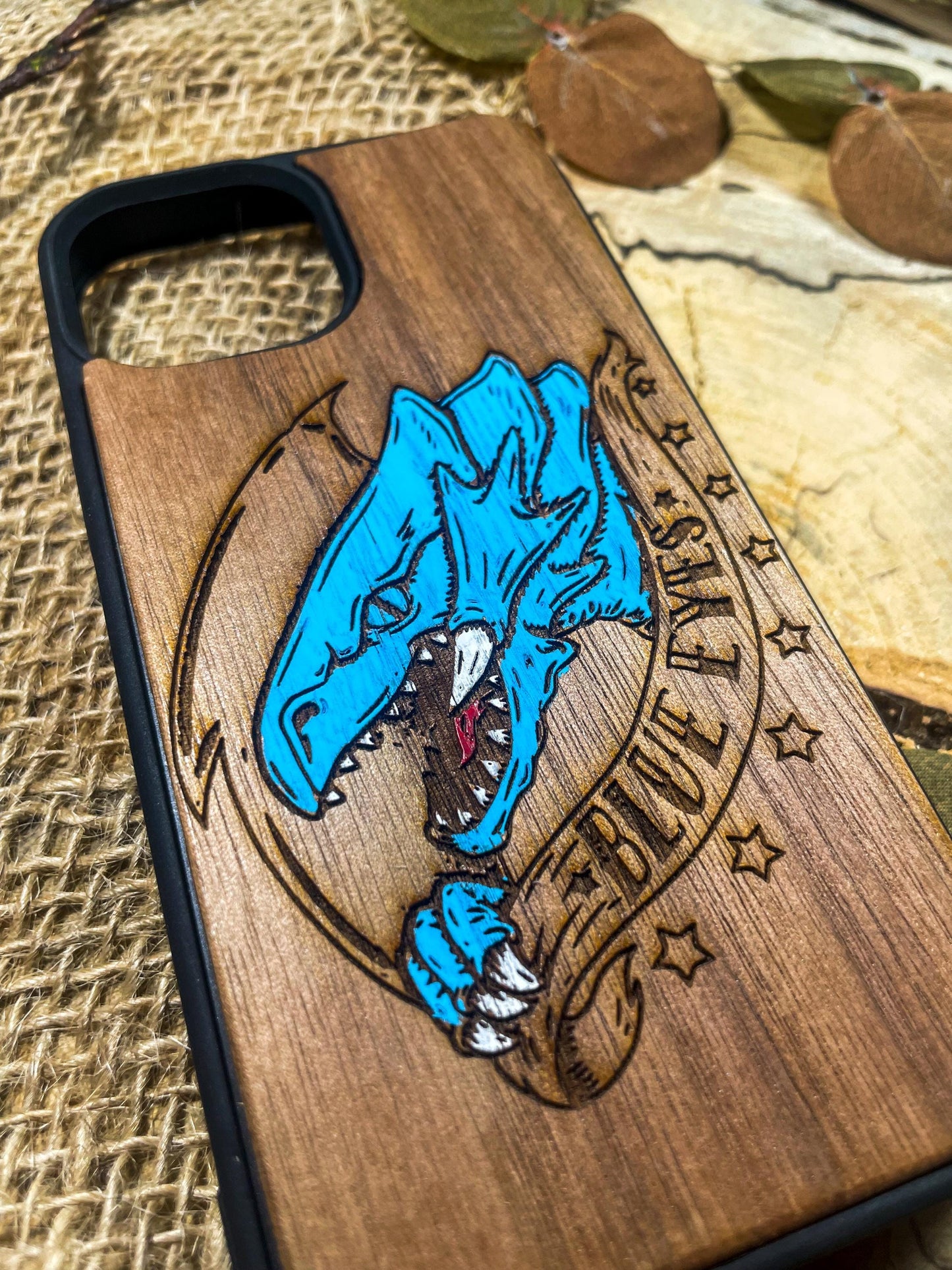 a wooden phone case with a picture of a wolf on it