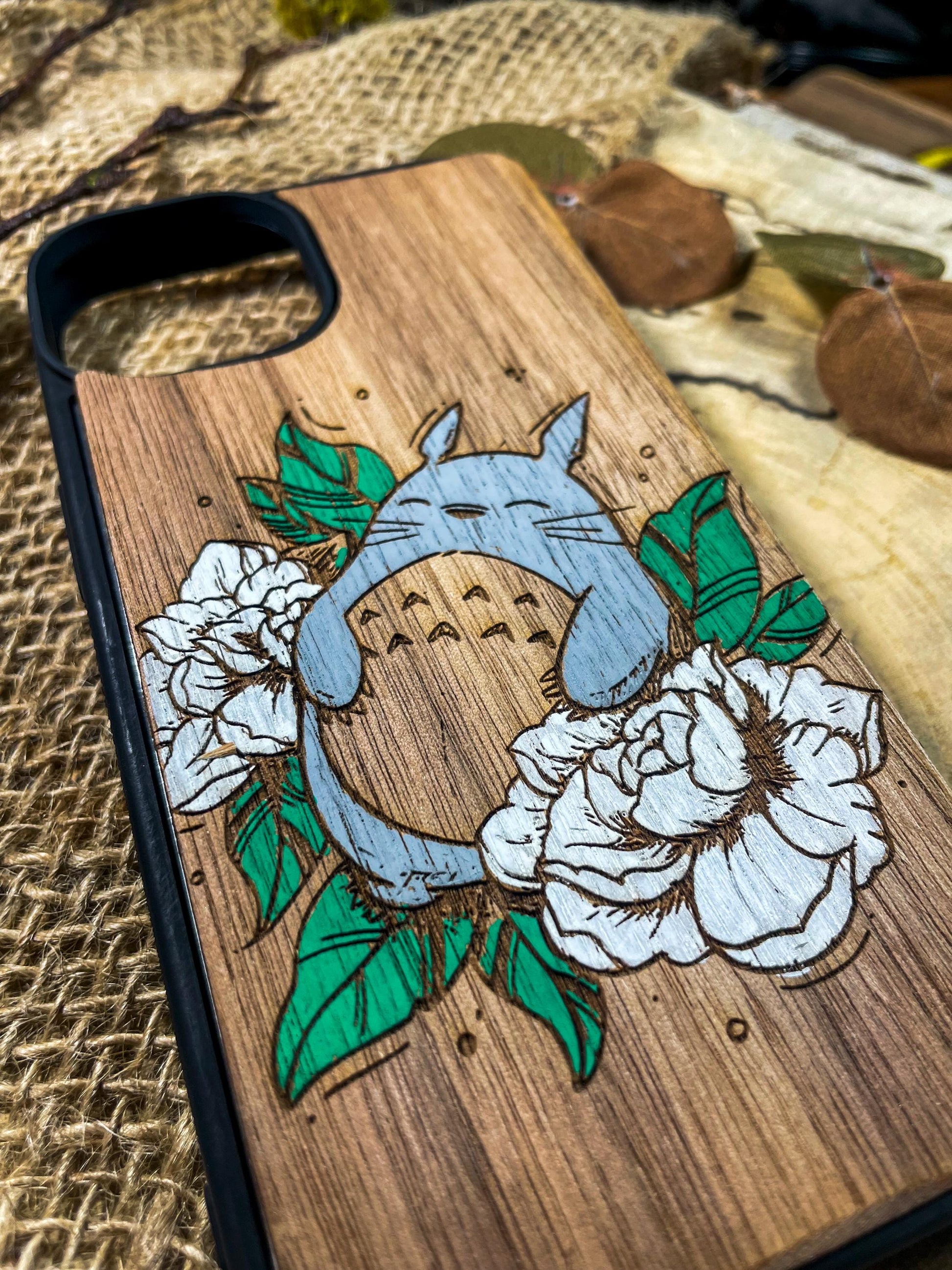 a wooden phone case with a picture of a horse on it