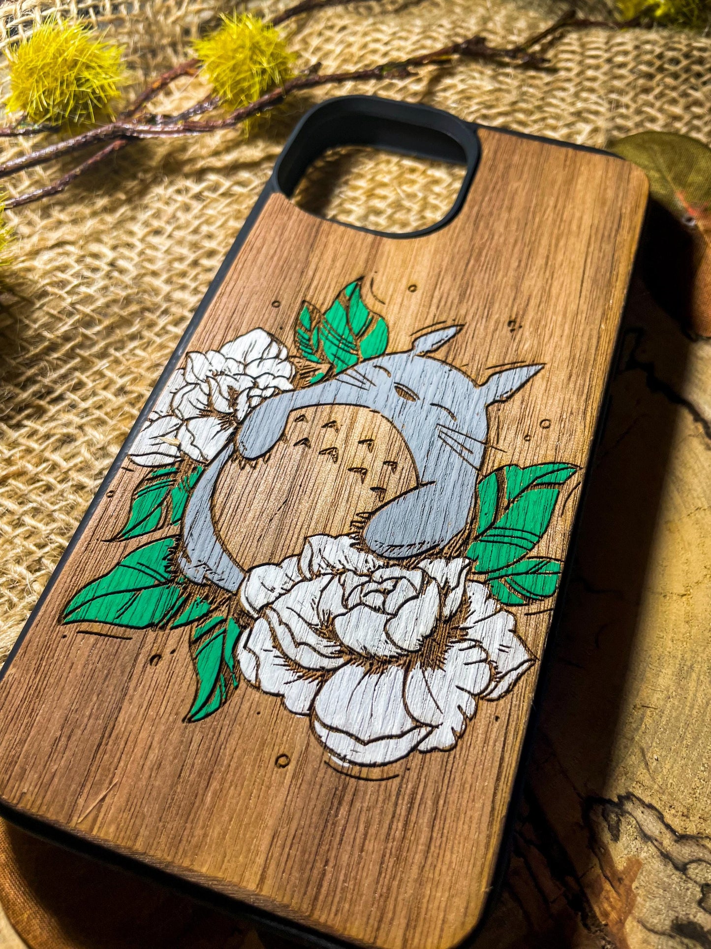 a wooden phone case with a picture of a bird on it