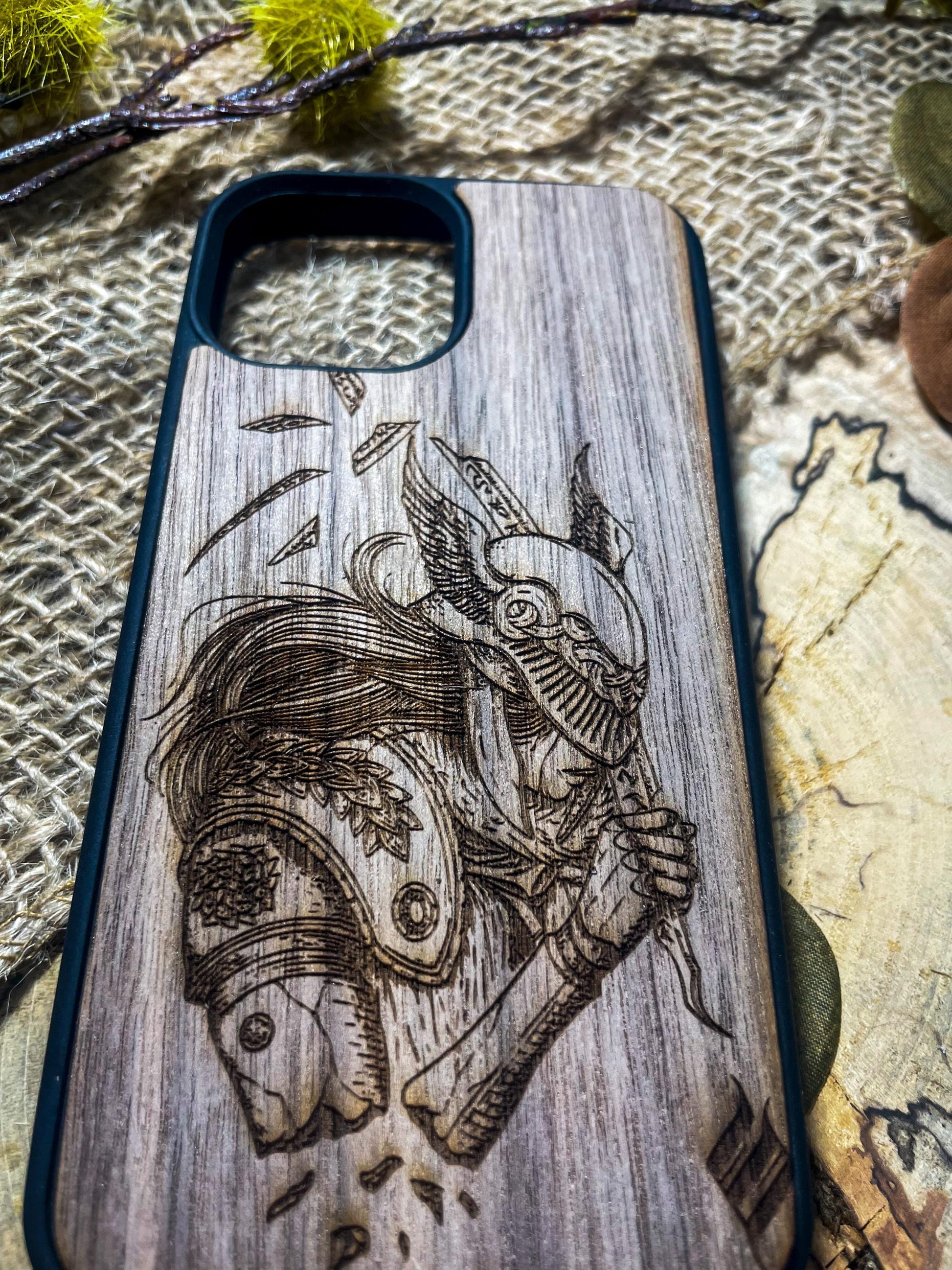 a wooden phone case with a picture of a skeleton on it