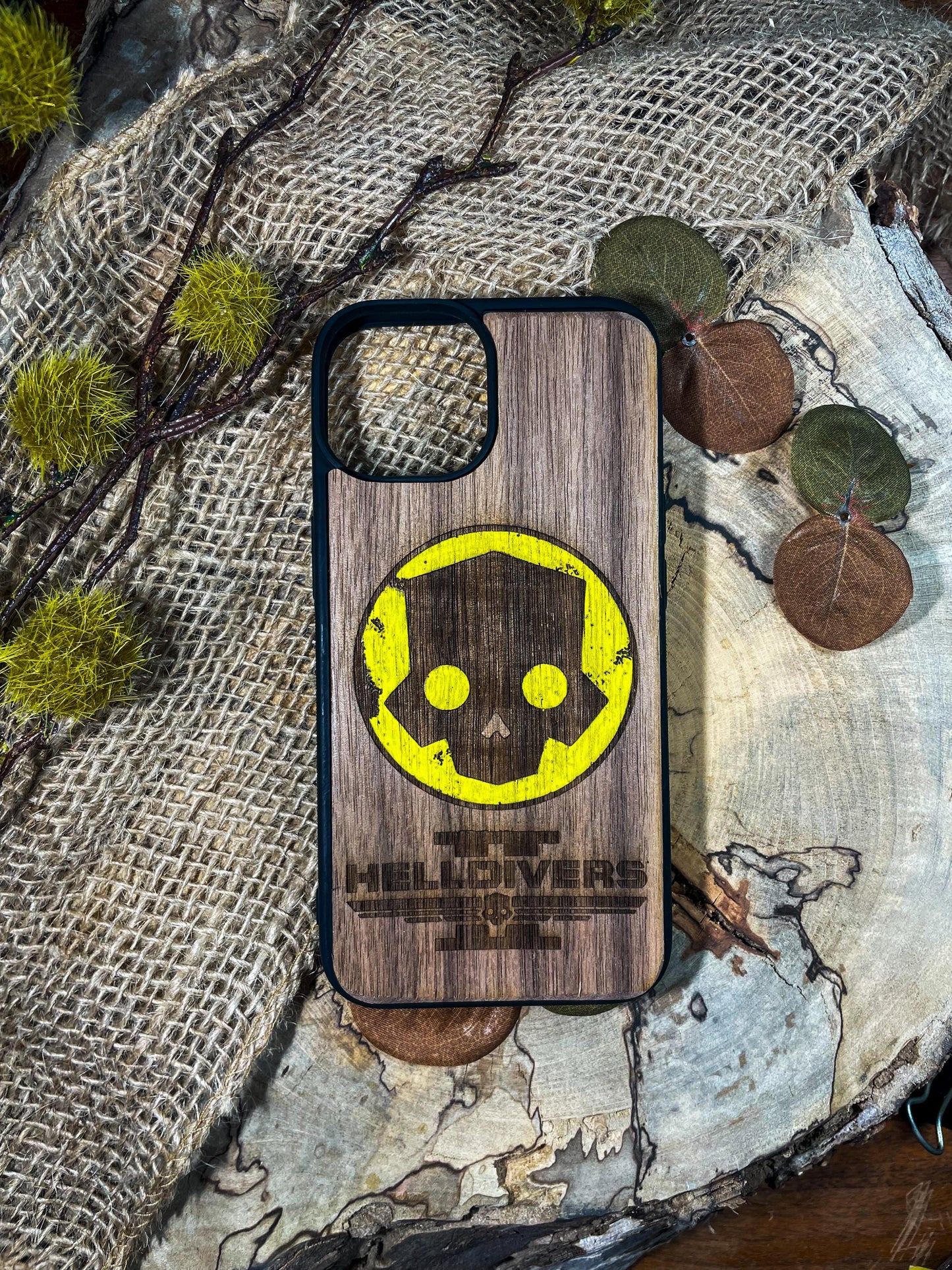 a wooden phone case with a smiley face on it