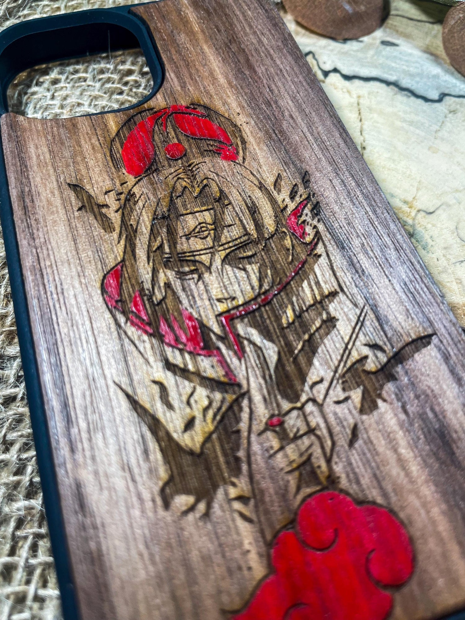 a wooden phone case with a picture of a pirate on it