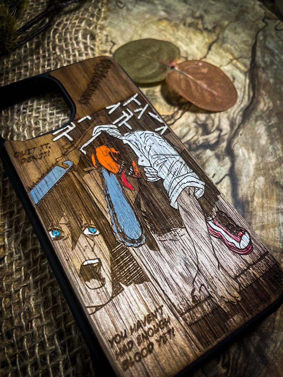 a wooden phone case with a picture of a person on it