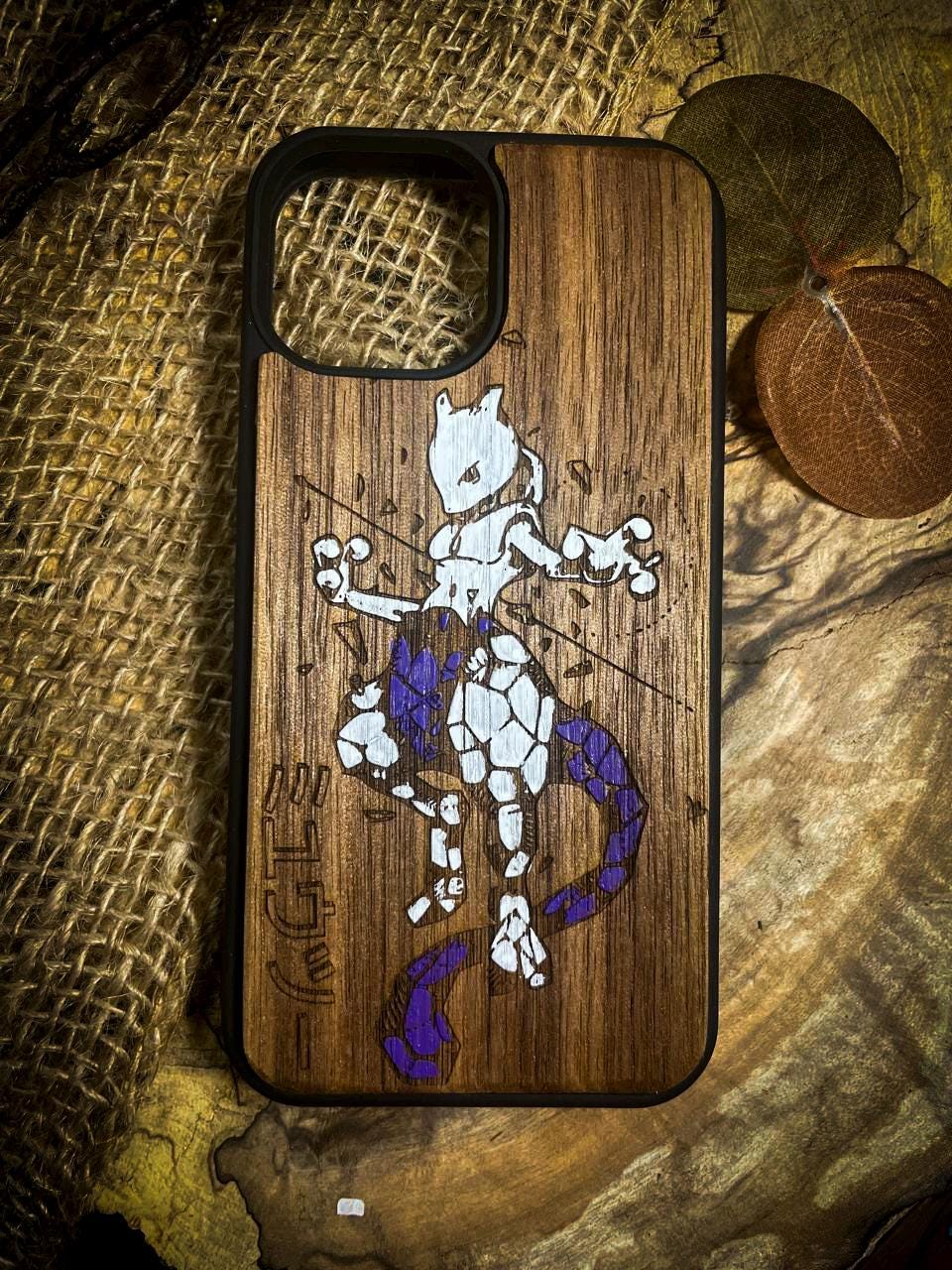 a wooden phone case with a picture of a cartoon character on it