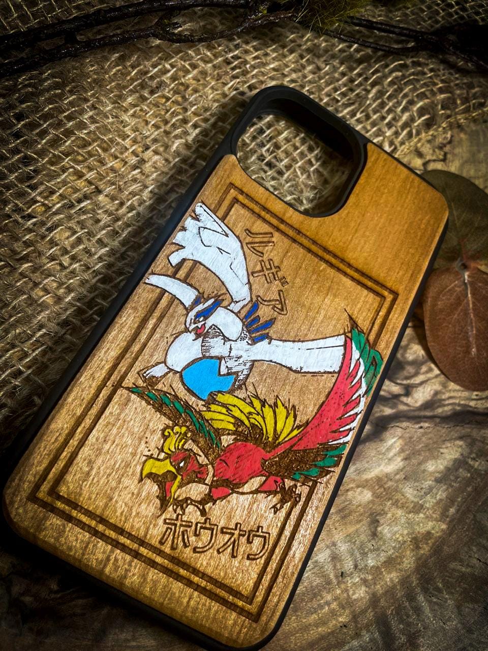 a wooden phone case with a picture of a dragon on it