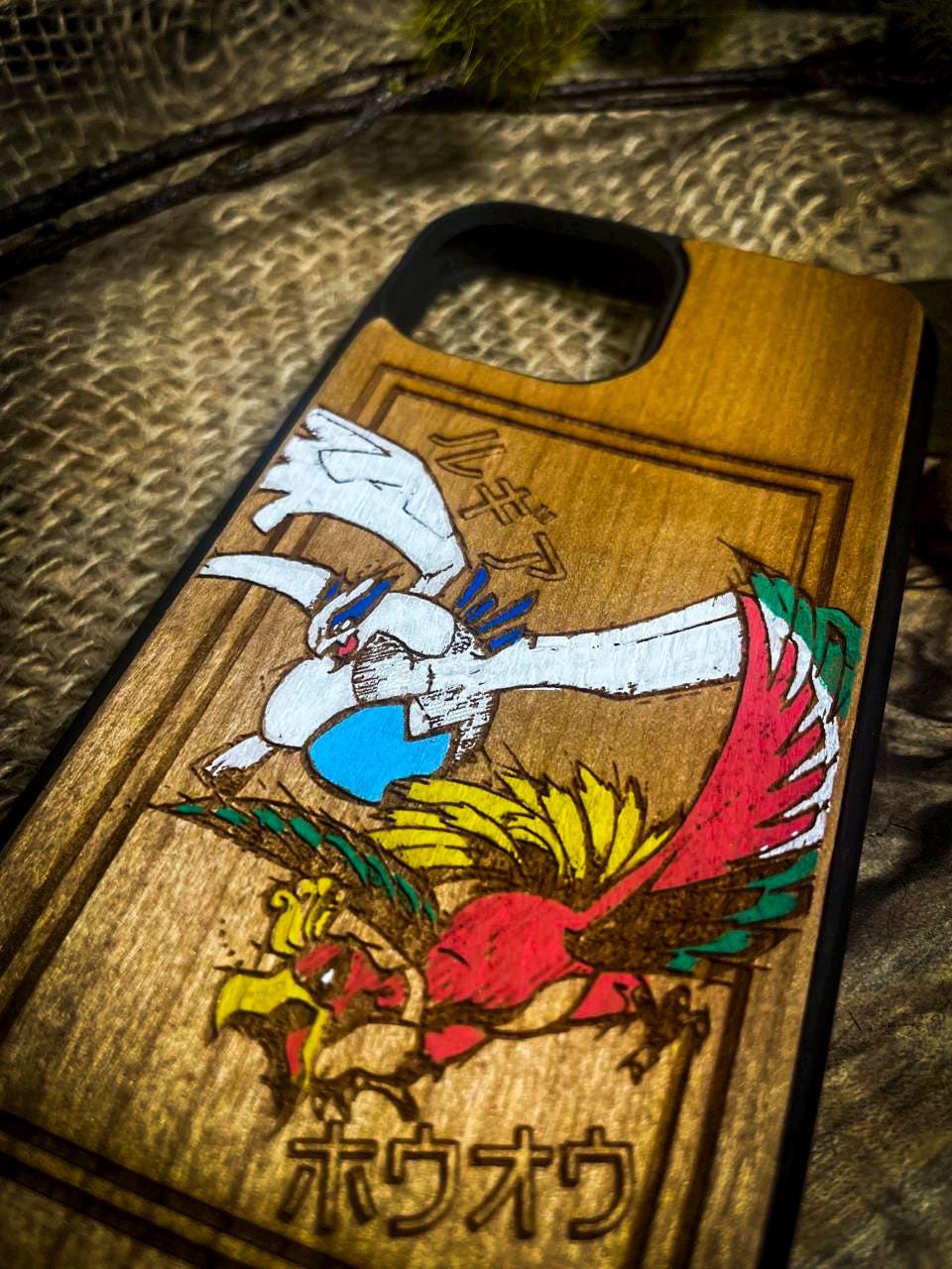 a wooden phone case with a picture of a bird on it