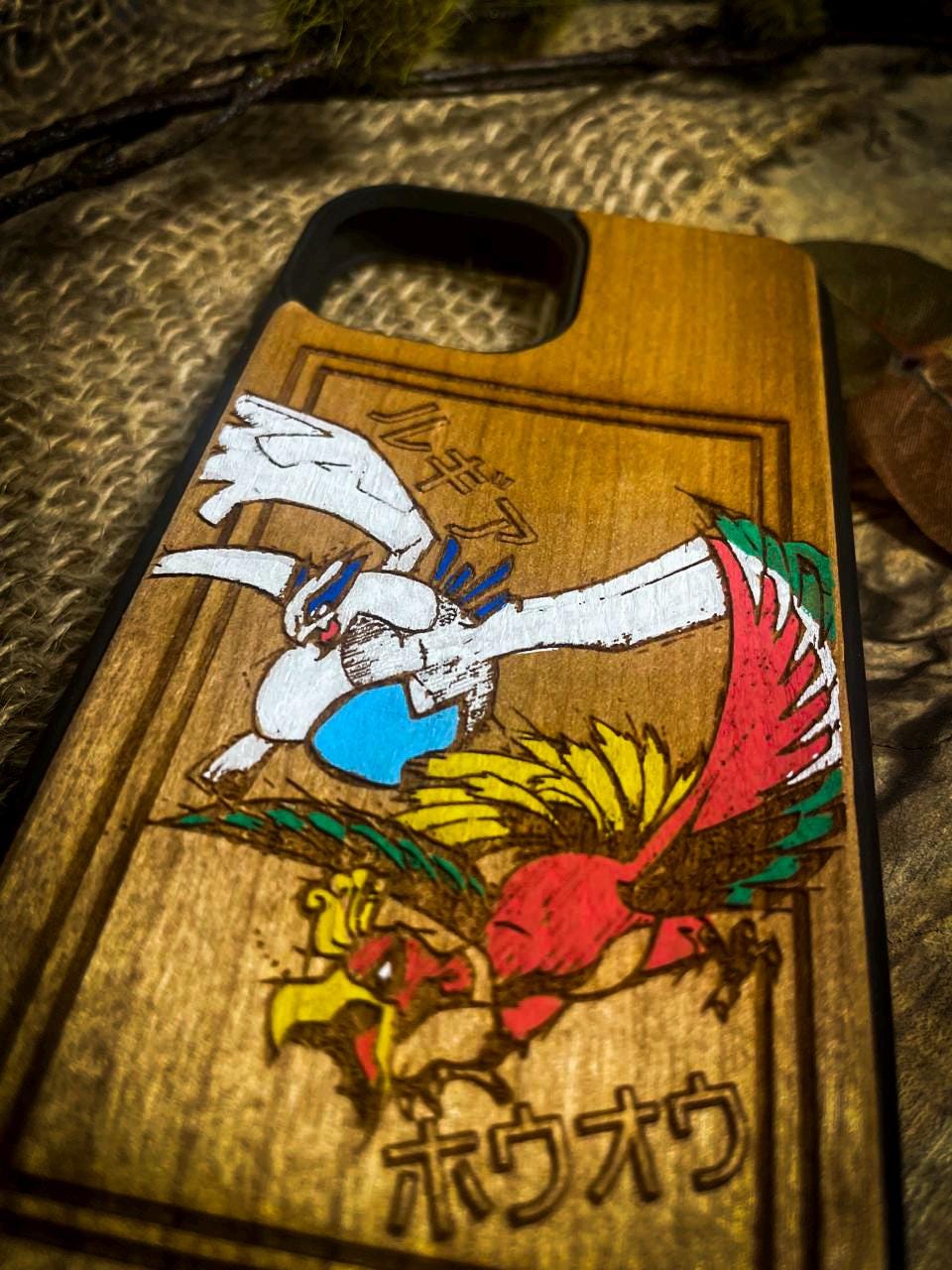 a wooden phone case with an image of a bird on it