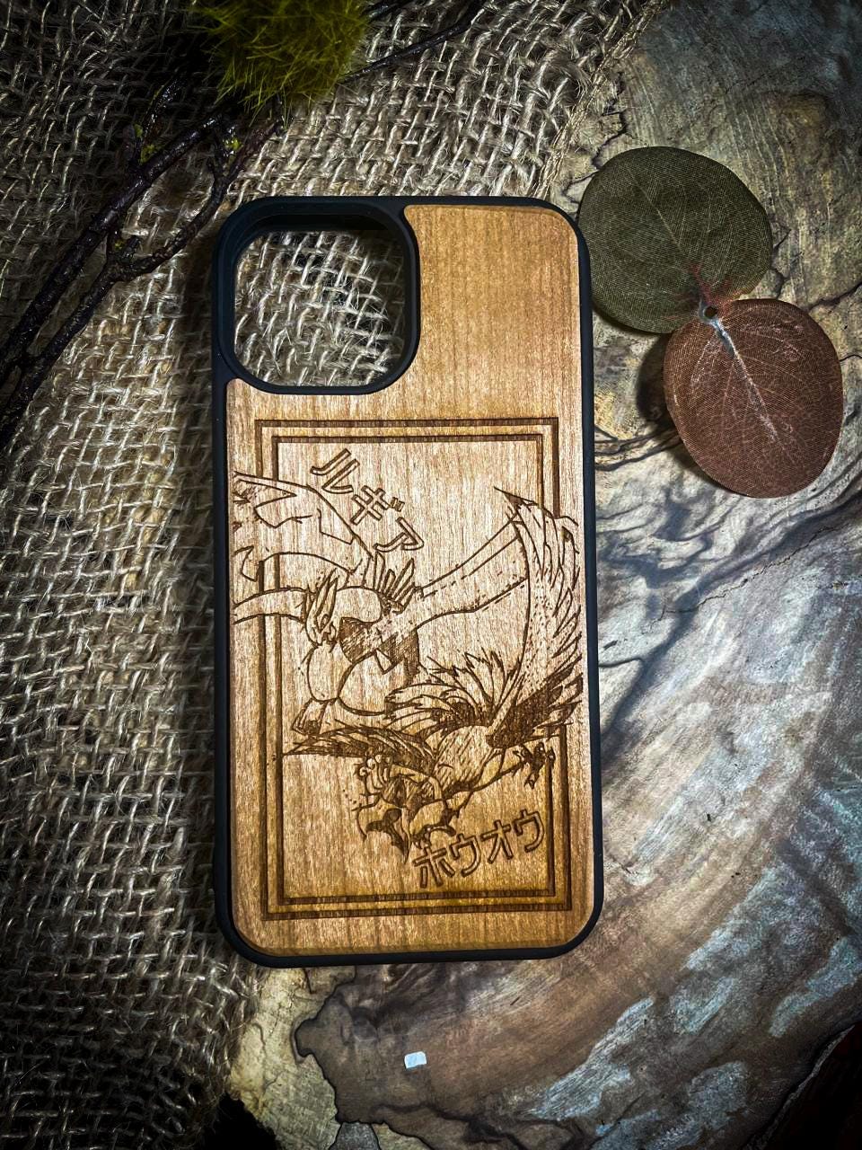 a wooden phone case with a picture of a dragon on it