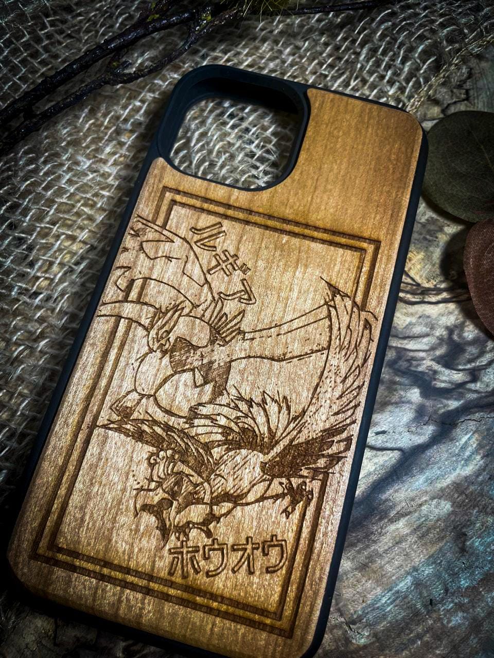 a wooden phone case with a picture of a dragon on it