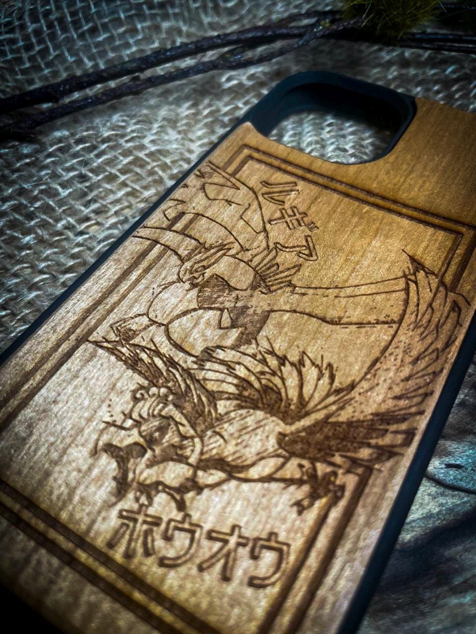 a wooden phone case with a picture of a dragon on it