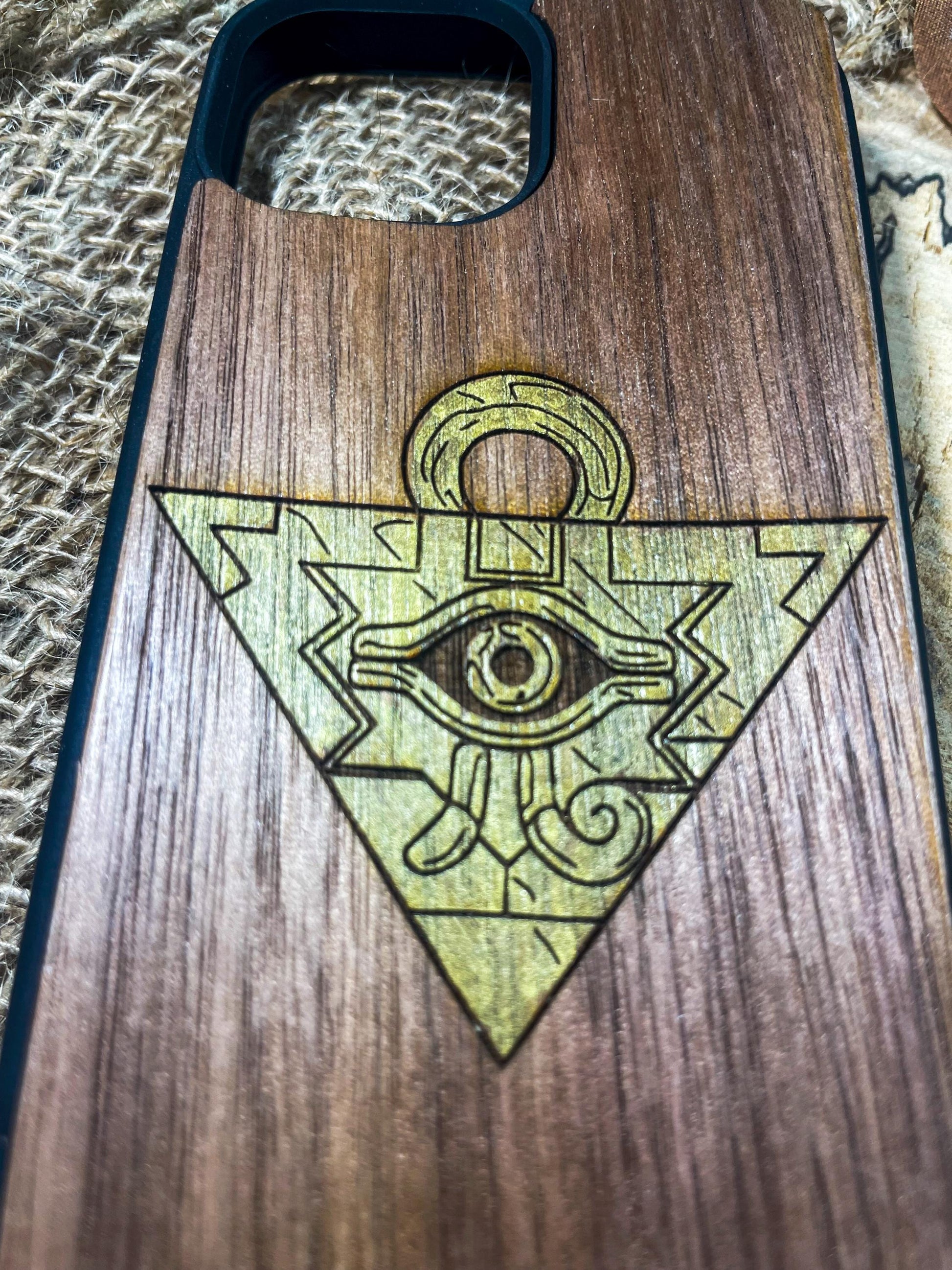 a wooden case with an all seeing eye on it