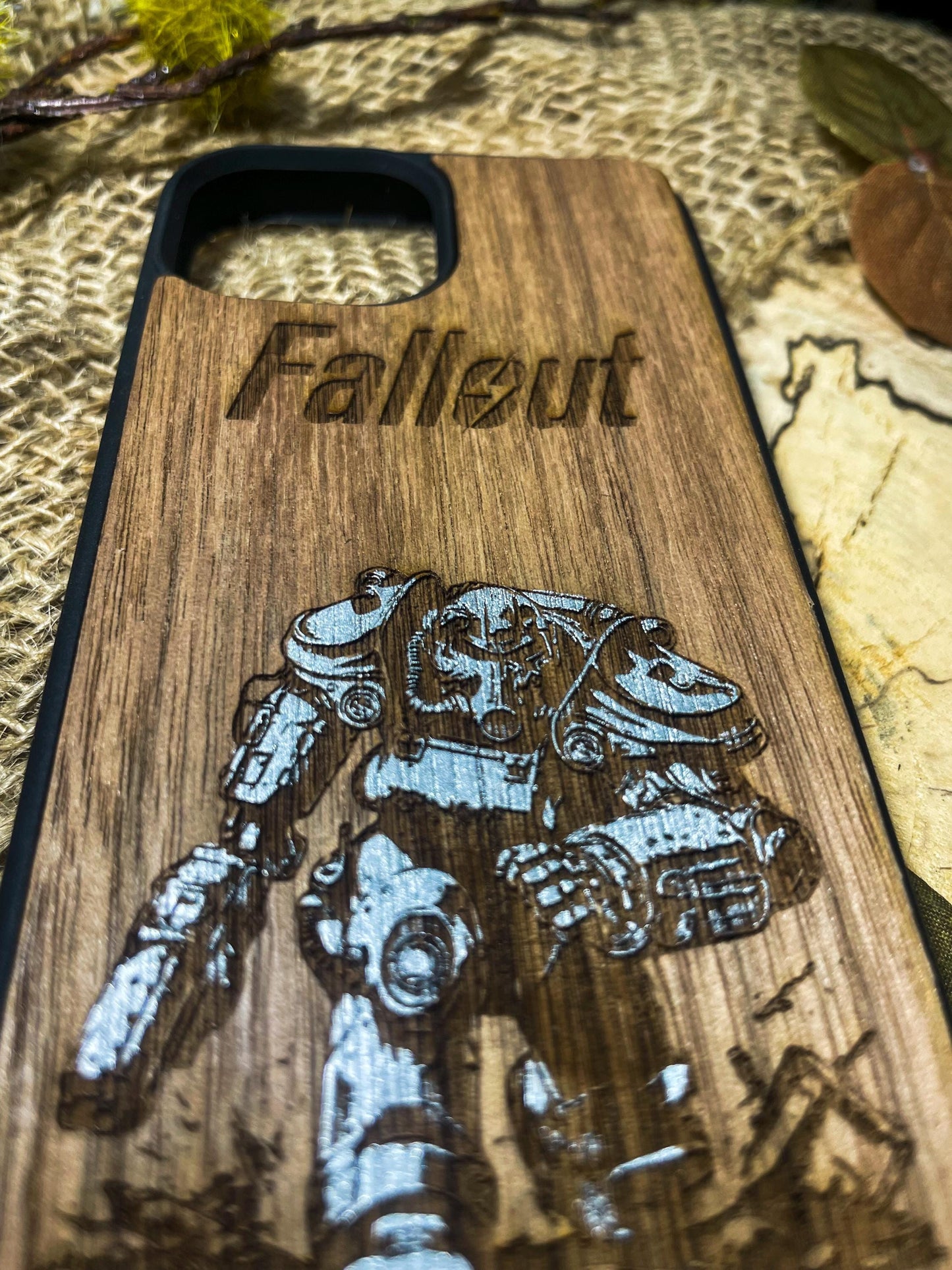 a wooden phone case with a picture of a man on a motorcycle