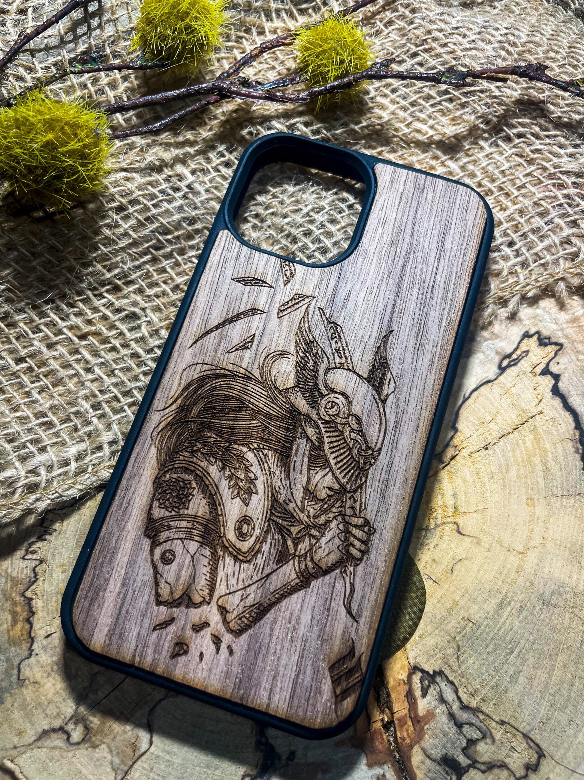 a wooden phone case with a picture of a man on a motorcycle