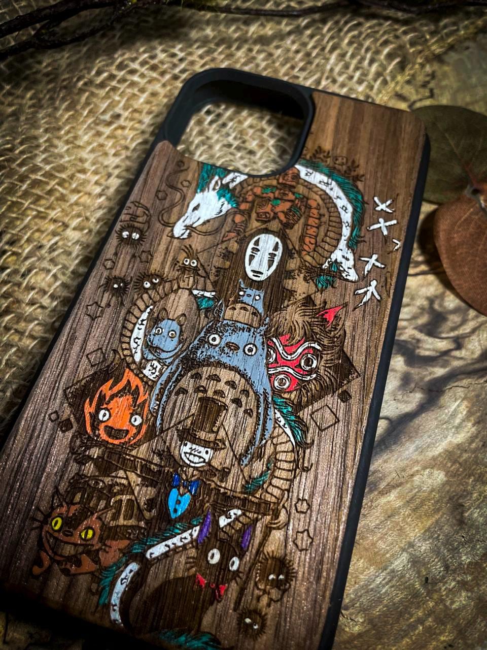 a bunch of wooden phone cases that are on a table