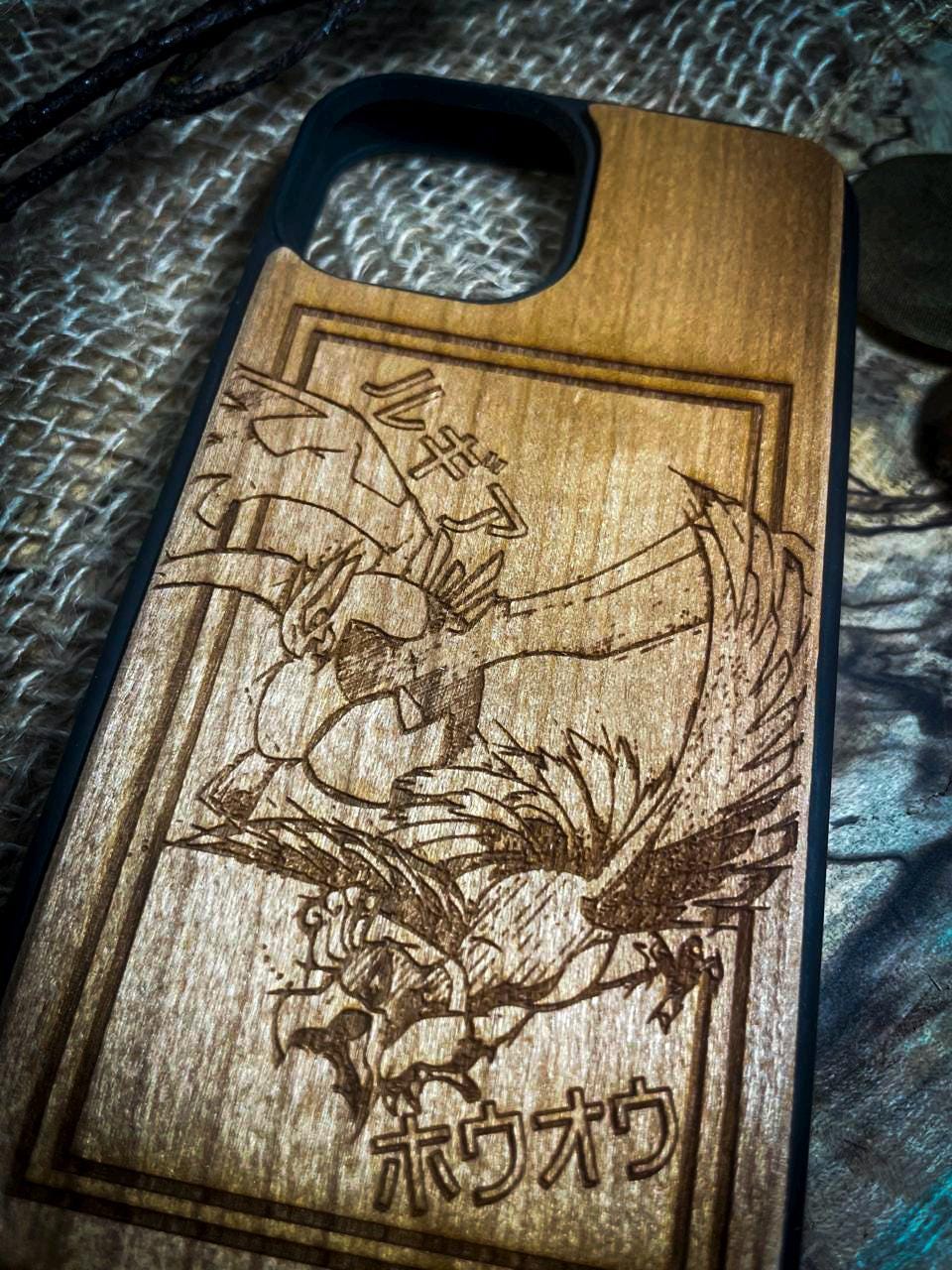 a wooden phone case with a picture of a dragon on it