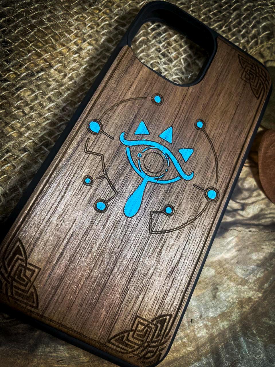 a wooden phone case with a design on it