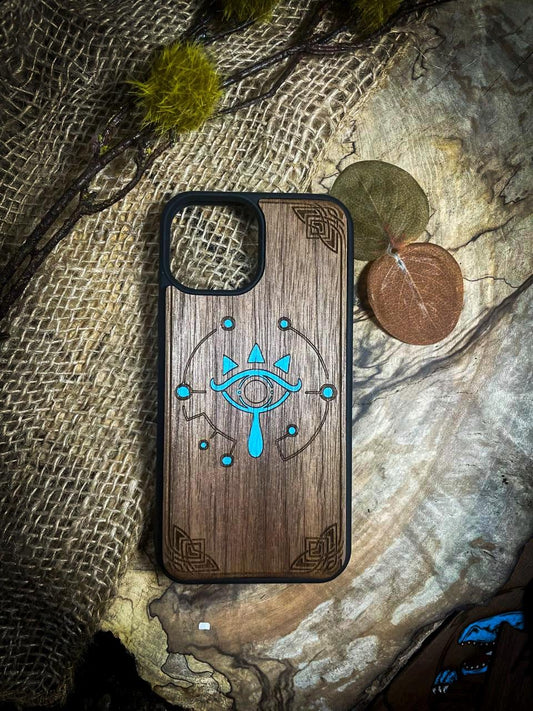 a wooden phone case with an eye on it