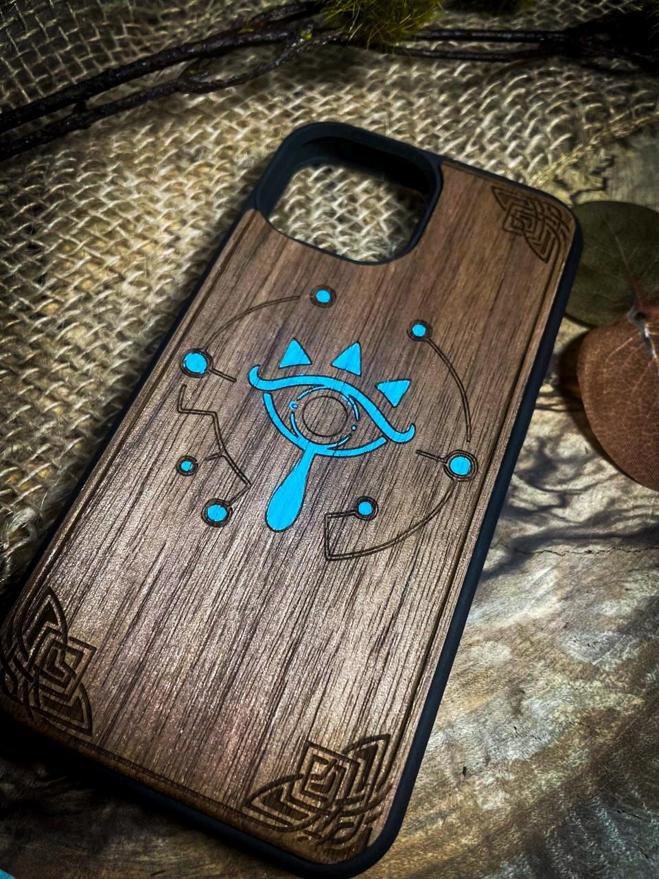 a wooden phone case with a blue design on it