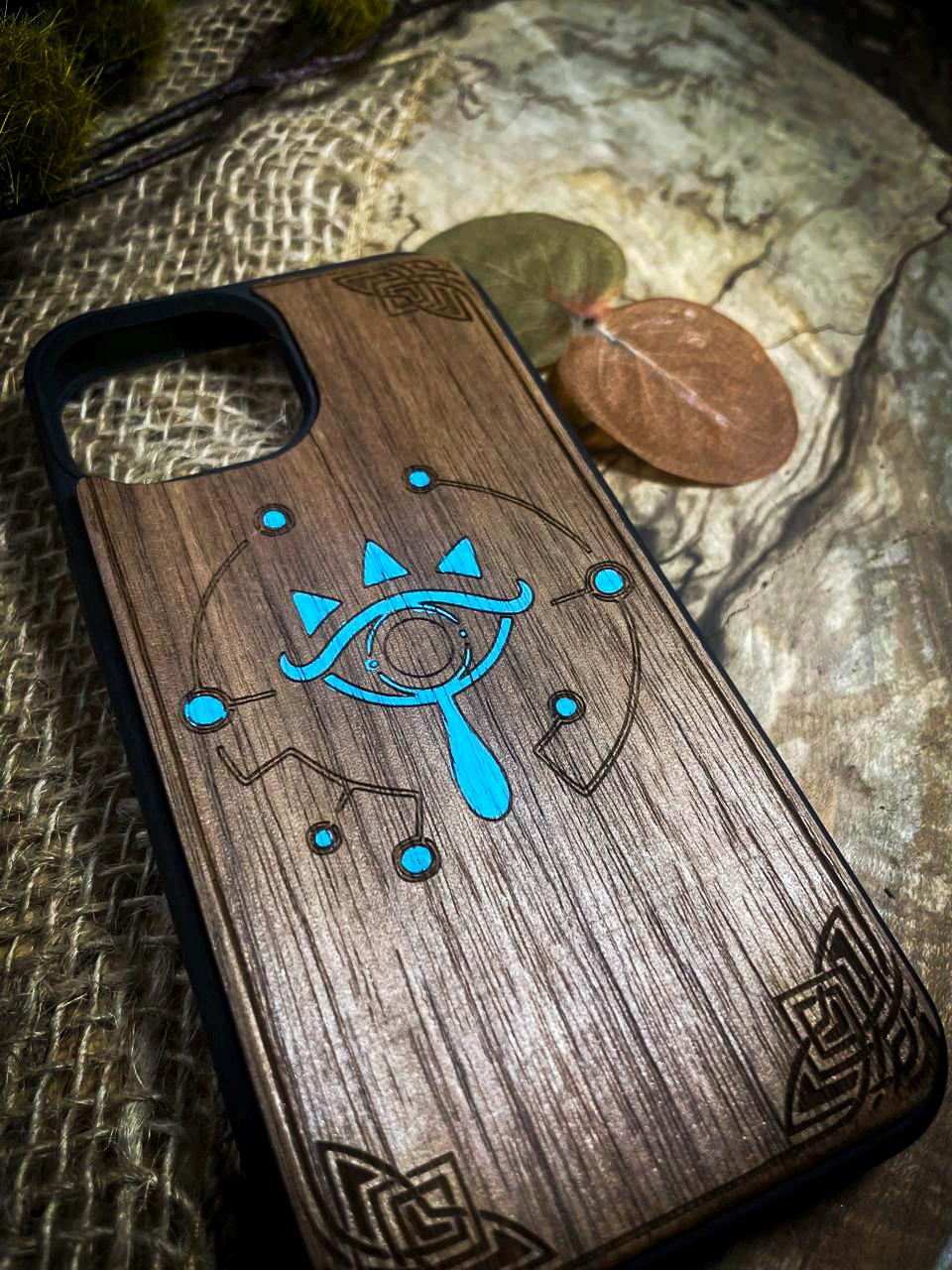 a wooden phone case with a design on it