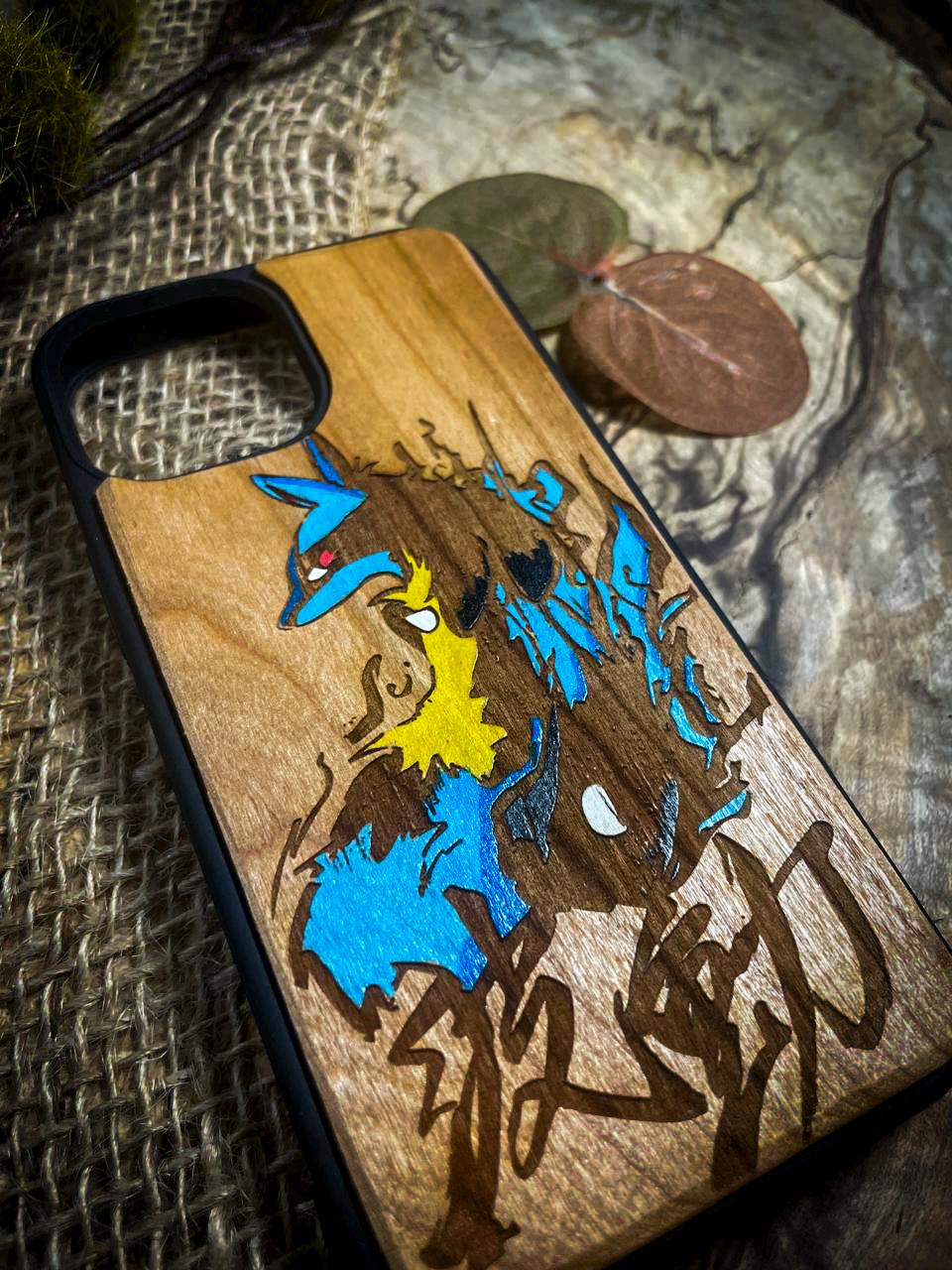 a wooden phone case with graffiti on it